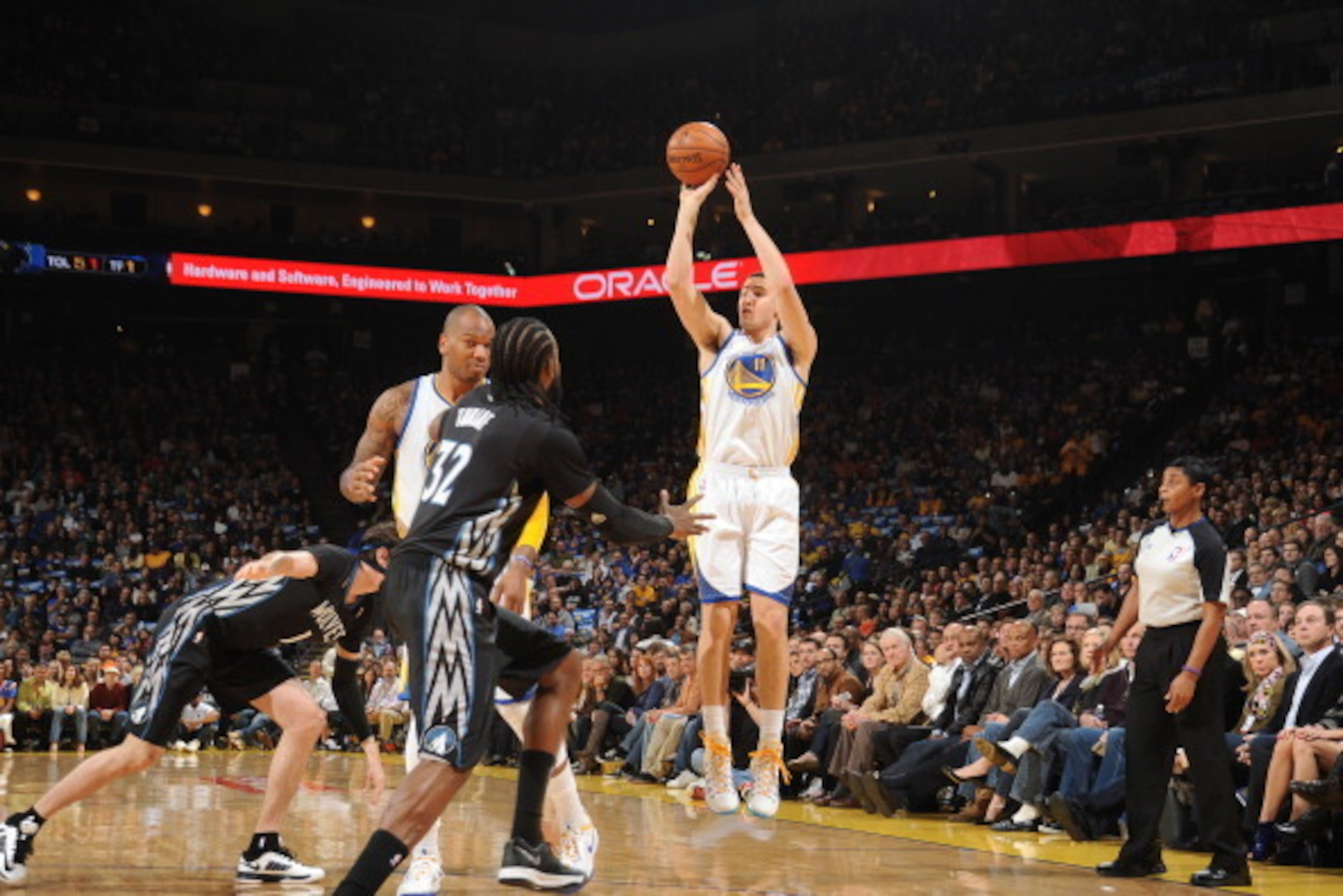 OAKLAND, CA - JANUARY 24: Klay Thompson #11 of the Golden State Warriors shoots a three pointer against the Minnesota Timberwolves on January 24, 2014 at Oracle Arena in Oakland, California. NOTE TO USER: User expressly acknowledges and agrees that, by do