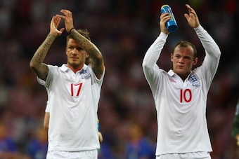 LONDON, ENGLAND - SEPTEMBER 09:  David Beckham (L) and Wayne Rooney of England applaud the fans at the end of the FIFA 2010 World Cup Group 6 Qualifying match between England and Croatia at Wembley Stadium on September 9, 2009 in London, England.  (Photo 