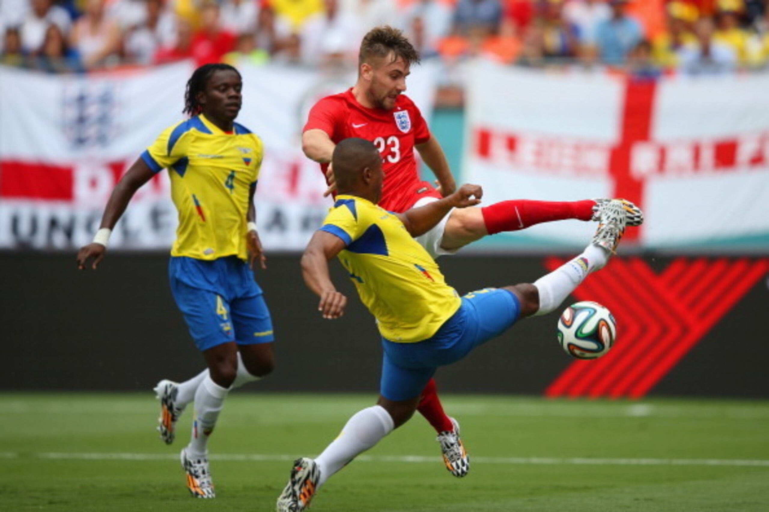 MIAMI GARDENS, FL - JUNE 04:  Luke Shaw of England and Jorge Guagua of Ecuador battle for the ball during the International friendly match between England and Ecuador at Sun Life Stadium on June 4, 2014 in Miami Gardens, Florida.  (Photo by Richard Heathc
