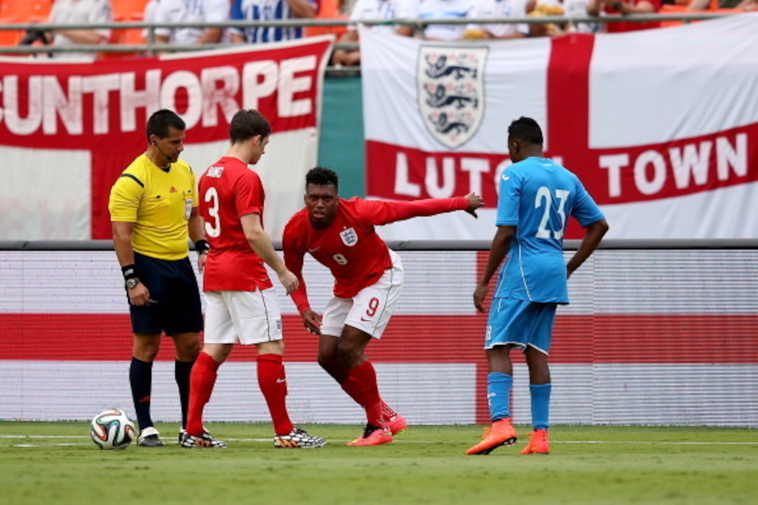 MIAMI GARDENS, FL - JUNE 07:  Daniel Sturridge of England sustains a heavy tackle during the International Friendly match between England and Honduras at the Sun Life Stadium on June 7, 2014 in Miami Gardens, Florida.  (Photo by Richard Heathcote/Getty Im