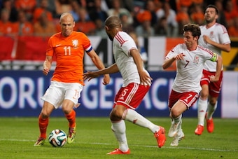 AMSTERDAM, NETHERLANDS - JUNE 04:  Arjen Robben of Netherlands runs on goal followed by Daniel Gabbidon and Joe Allen of Wales during the International Friendly match between The Netherlands and Wales at Amsterdam Arena on June 4, 2014 in Amsterdam, Nethe