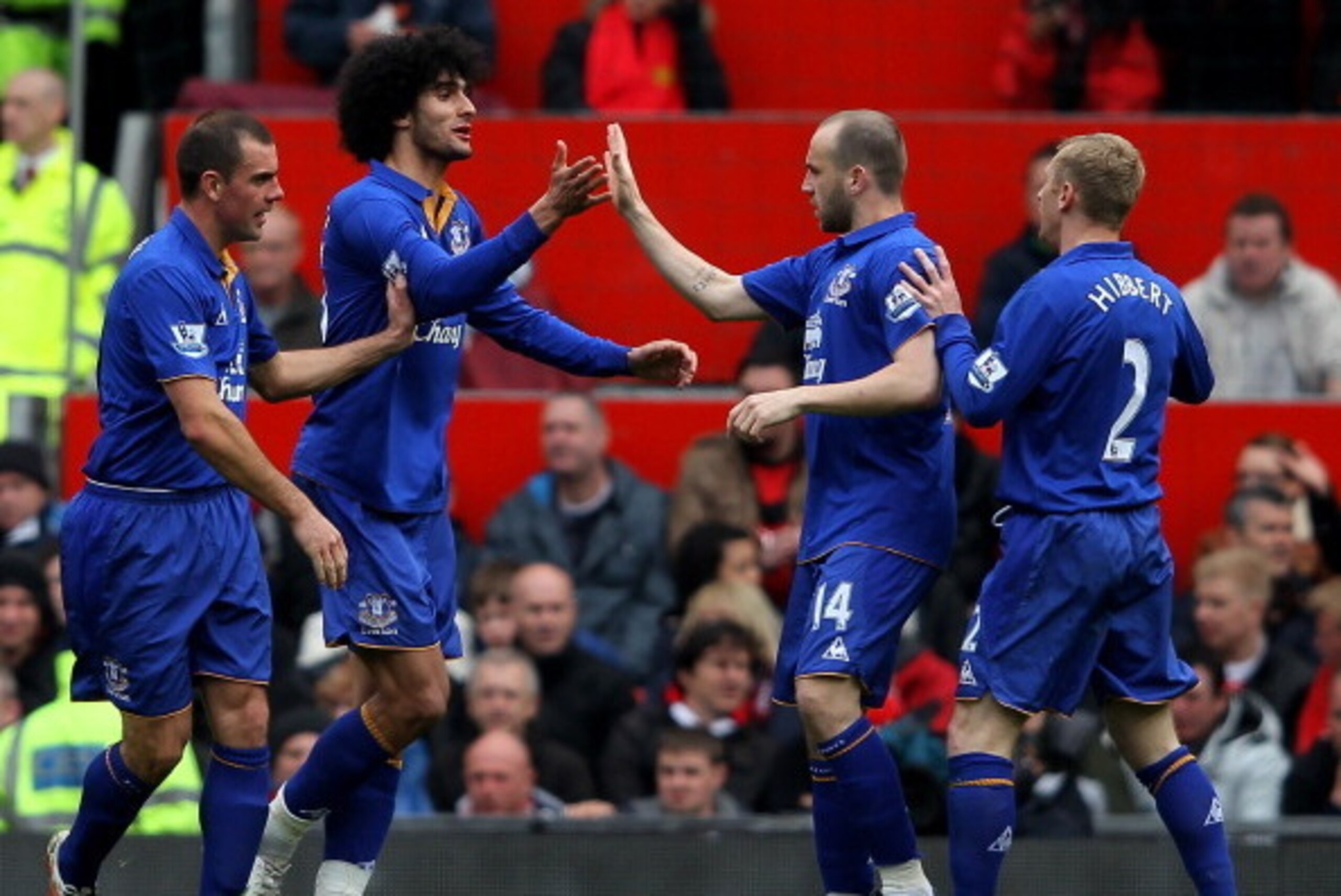 MANCHESTER, ENGLAND - APRIL 22:  Marouane Fellaini of Everton celebrates scoring his team's second goal with his team mates during the Barclays Premier League match between Manchester United and Everton at Old Trafford on April 22, 2012 in Manchester, Eng