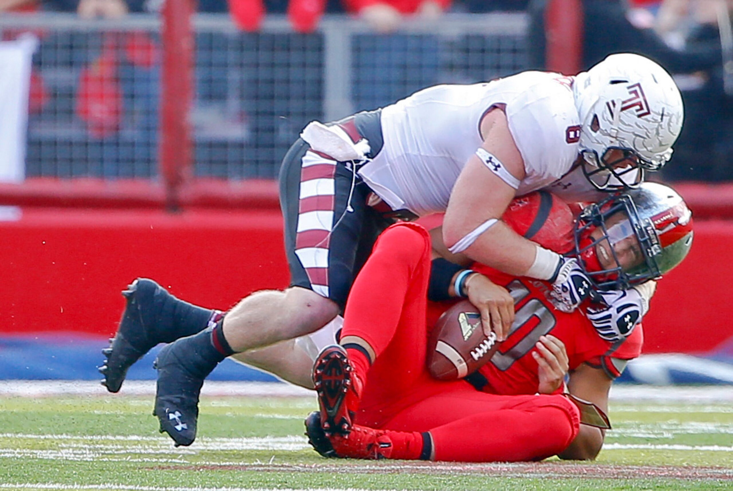 Nov 2, 2013; Piscataway, NJ, USA;  Temple Owls linebacker Tyler Matakevich (8) sacks Rutgers Scarlet Knights quarterback Gary Nova (10) during the second half at High Points Solutions Stadium. Rutgers won 23-20. Mandatory Credit: Jim O'Connor-USA TODAY Sp