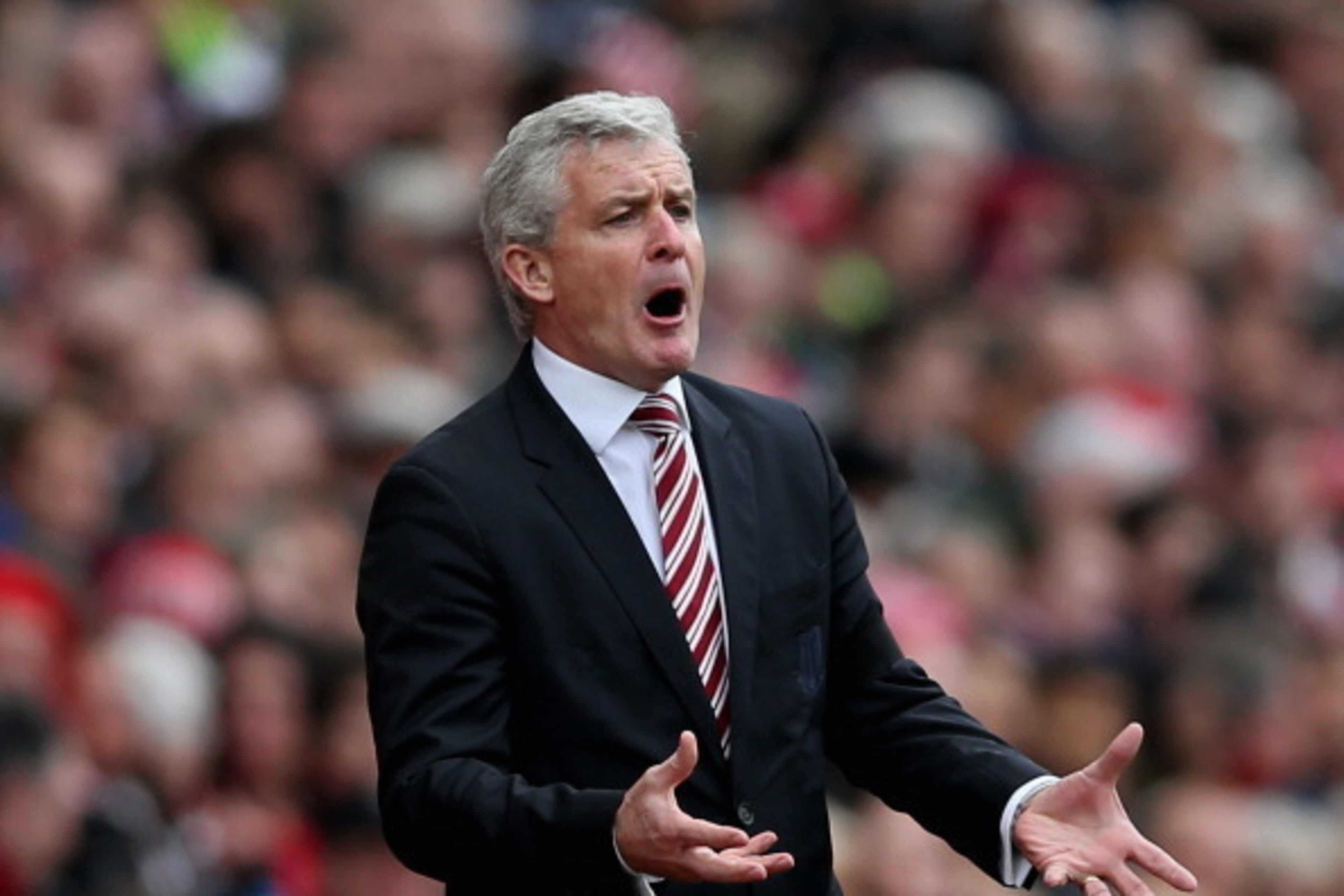 STOKE ON TRENT, ENGLAND - APRIL 12:  Stoke City Manager Mark Hughes reacts during the Barclays Premier League match between Stoke City and Newcastle United at Britannia Stadium on April 12, 2014 in Stoke on Trent, England.  (Photo by Clive Brunskill/Getty