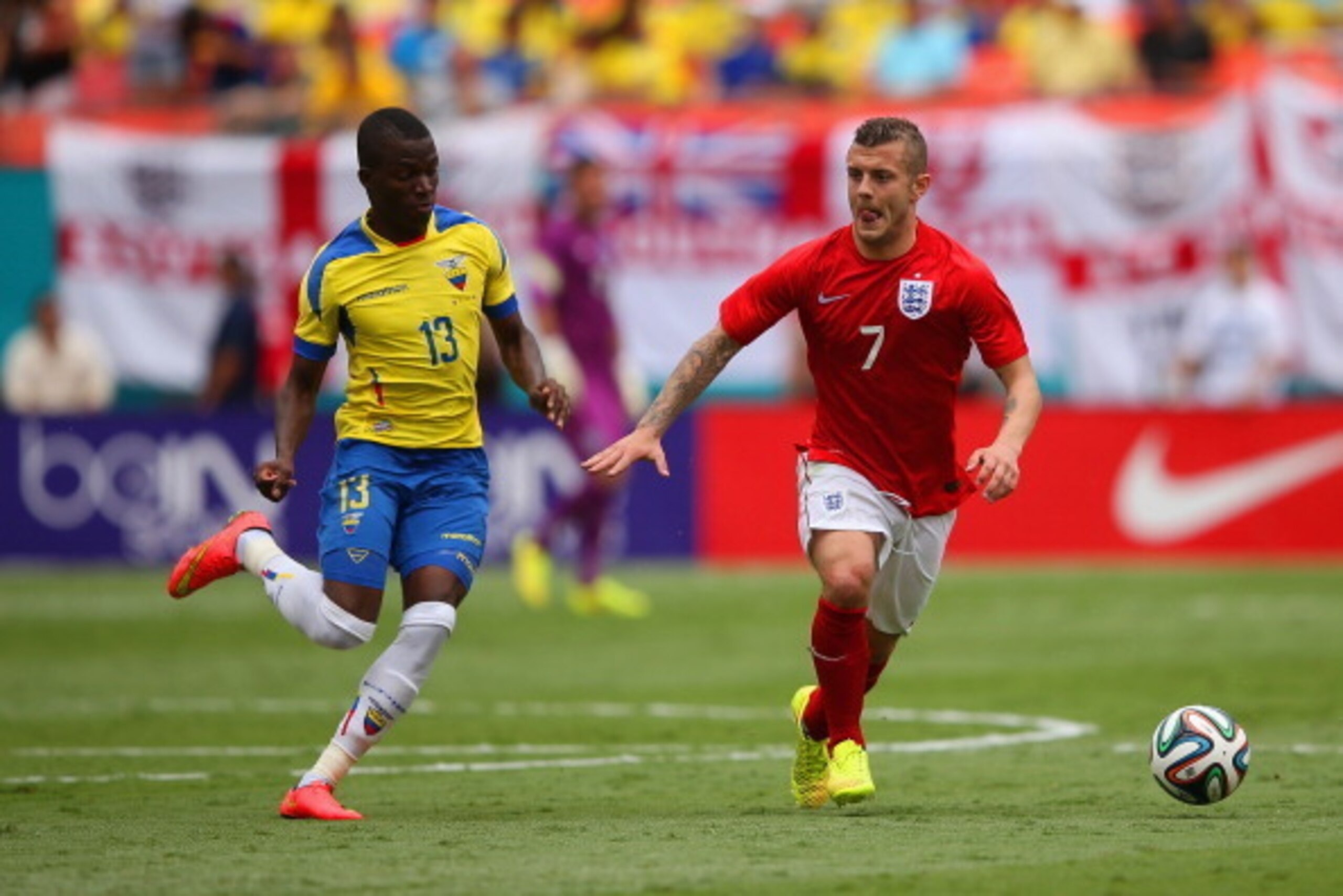 MIAMI GARDENS, FL - JUNE 04:  Jack Wilshere of England holds off Enner Valencia of Ecuador during the International friendly match between England and Ecuador at Sun Life Stadium on June 4, 2014 in Miami Gardens, Florida.  (Photo by Richard Heathcote/Gett