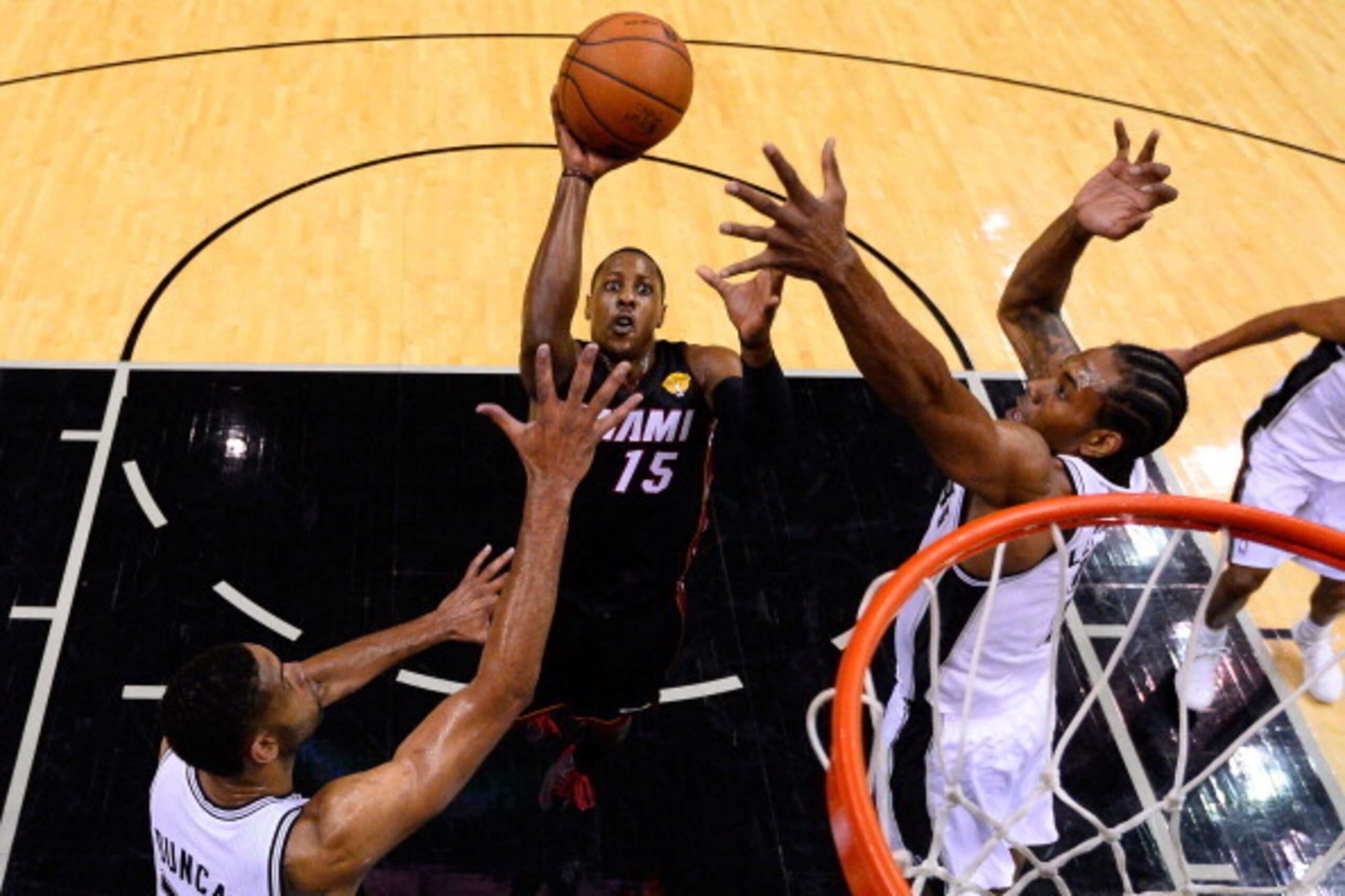 SAN ANTONIO, TX - JUNE 08: Mario Chalmers #15 of the Miami Heat goes to the basket against the San Antonio Spurs during Game Two of the 2014 NBA Finals at the AT&T Center on June 8, 2014 in San Antonio, Texas. NOTE TO USER: User expressly acknowledges and