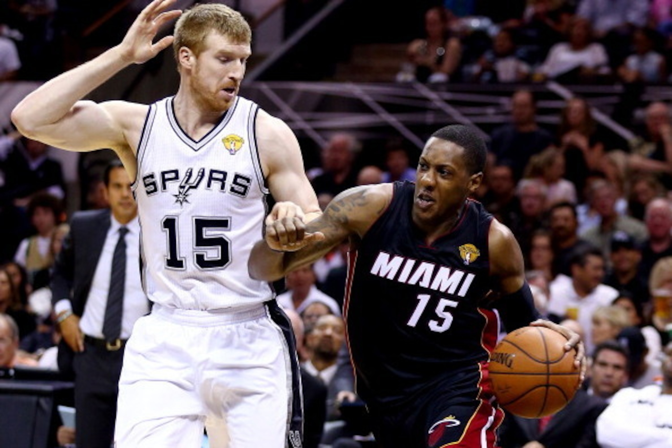 SAN ANTONIO, TX - JUNE 08:  Mario Chalmers #15 of the Miami Heat drives to the basket against Matt Bonner #15 of the San Antonio Spurs during Game Two of the 2014 NBA Finals at the AT&T Center on June 8, 2014 in San Antonio, Texas. NOTE TO USER: User expr