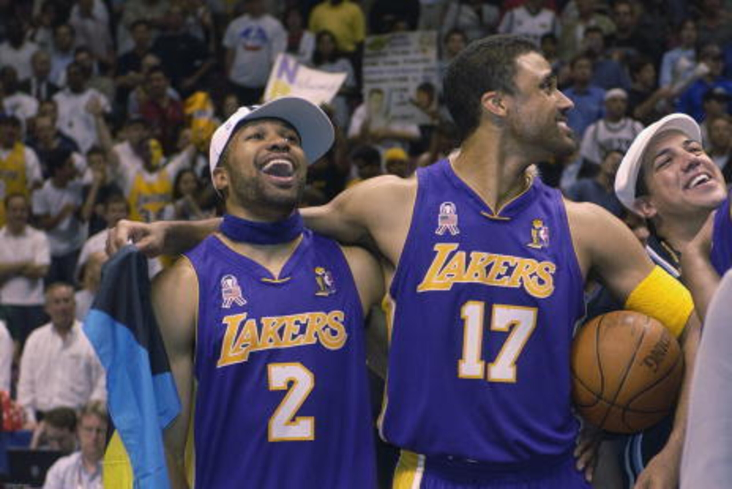 EAST RUTHERFORD, NJ - JUNE 12:  Derek Fisher #2 and Rick Fox #17 of the Los Angeles Lakers celebrate the Lakers championship after Game four of the 2002 NBA Finals against the New Jersey Nets on June 12, 2002 at Continental Airlines Arena in East Rutherfo