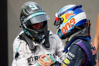 MONTREAL, QC - JUNE 08:  Racewinner Daniel Ricciardo of Australia and Infiniti Red Bull Racing is congratulated by Nico Rosberg of Germany and Mercedes GP following his victory during the Canadian Formula One Grand Prix at Circuit Gilles Villeneuve on Jun