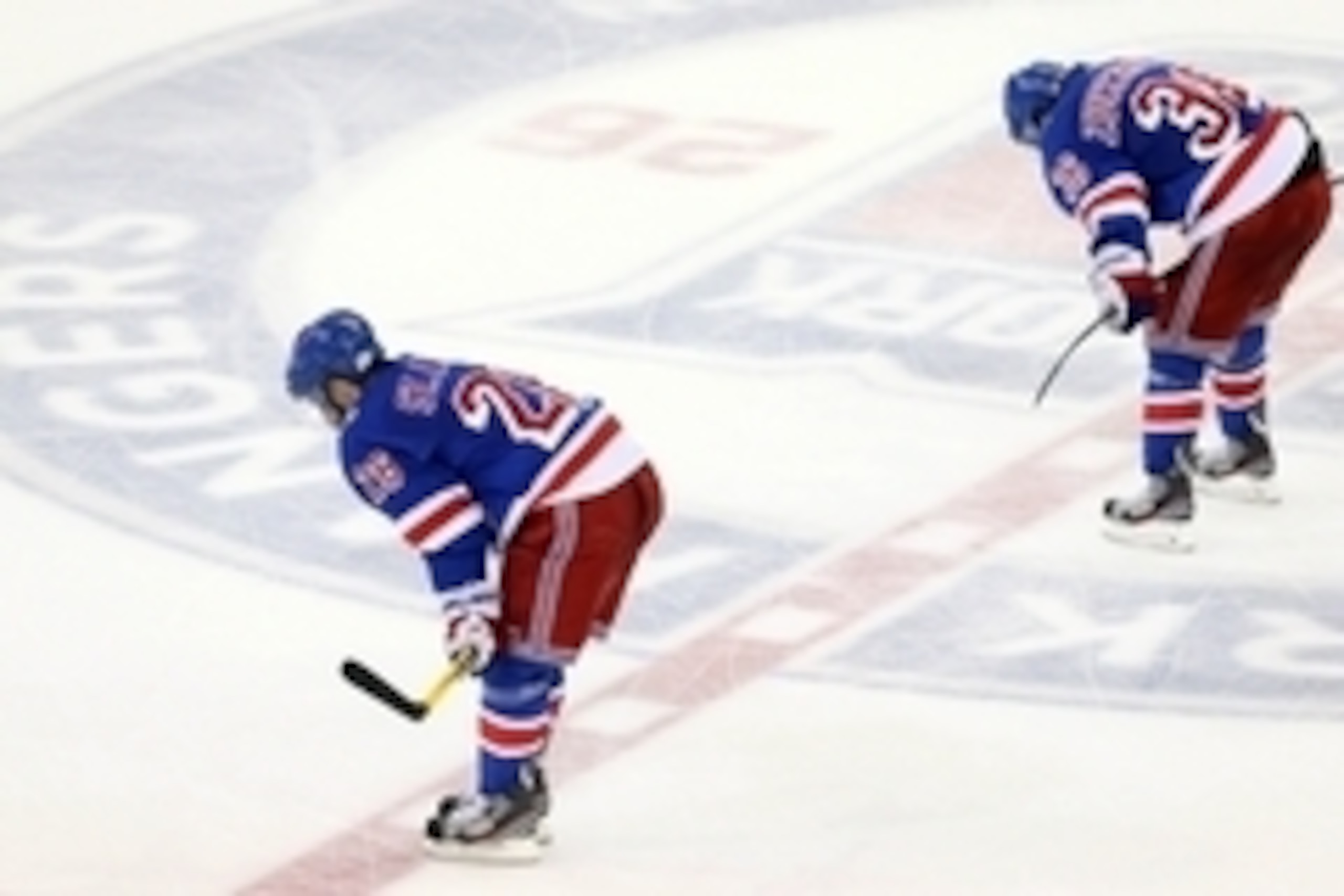 Jun 9, 2014; New York, NY, USA; New York Rangers right wing Martin St. Louis (26) and right wing Mats Zuccarello (36) skate off the ice after game three of the 2014 Stanley Cup Final against the Los Angeles Kings at Madison Square Garden. The Kings won 3-