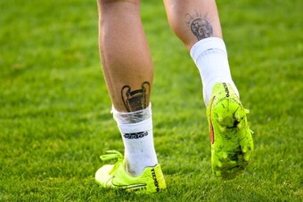 CURITIBA, BRAZIL - JUNE 09: Tattoos of the UEFA Champions League and the World Cup trophies are seen on Sergio Ramos of Spain during a Spain training session at the Centro de Entrenamiento do Caju on June 9, 2014 in Curitiba, Brazil.  (Photo by David Ramo