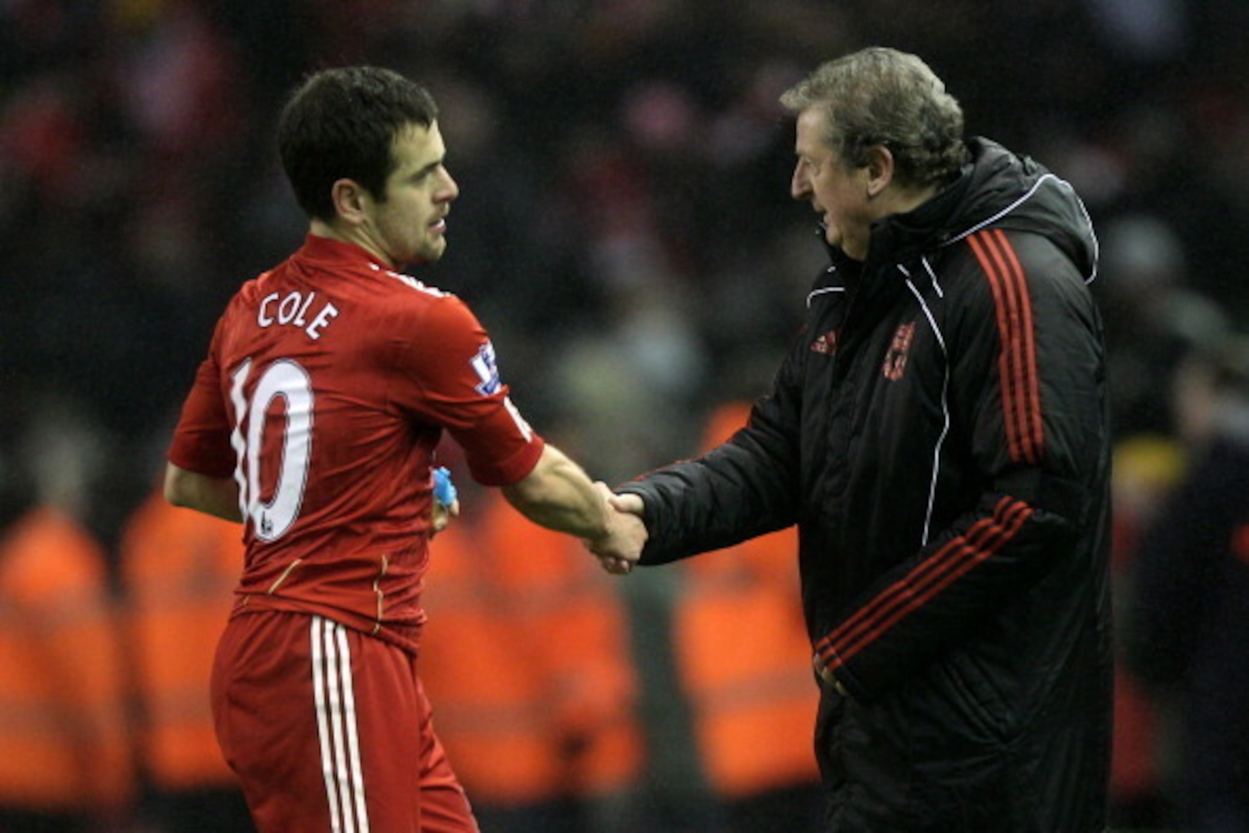 LIVERPOOL, ENGLAND - JANUARY 01:  Liverpool Manager Roy Hodgson shakes hands with Joe Cole of Liverpool at the end of the Barclays Premier League match between Liverpool and Bolton Wanderers at Anfield on January 1, 2011 in Liverpool, England.  (Photo by 