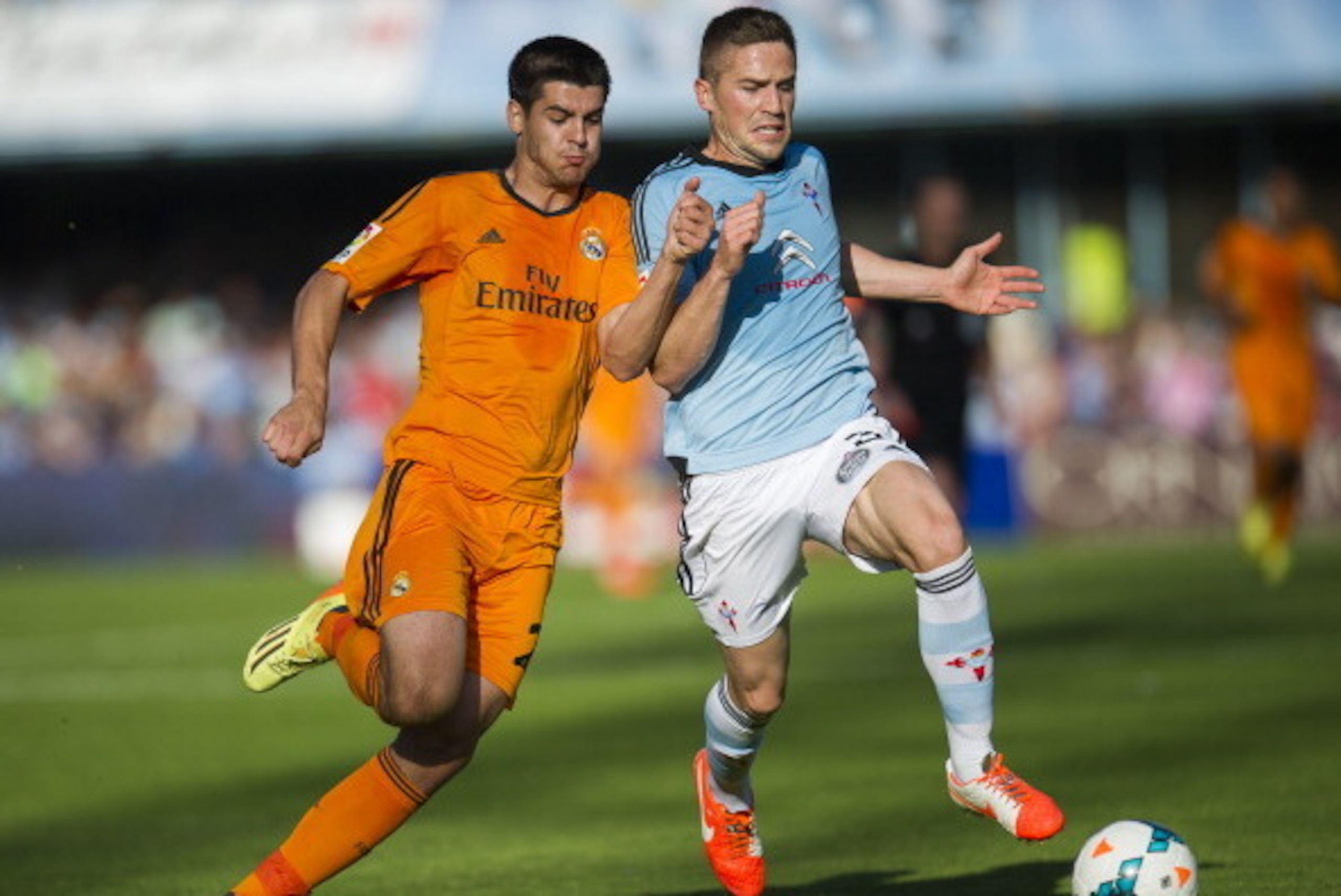 VIGO, SPAIN - MAY 11:  Alvaro Morata of Real Madrid CF duels for the ball with Andreu Fontas of RC Celta De Vigo during the la Liga match between Real Club Celta De Vigo and Real Madrid CF at Estadio Balaidos on May 11, 2014 in Vigo, Spain.  (Photo by Jua