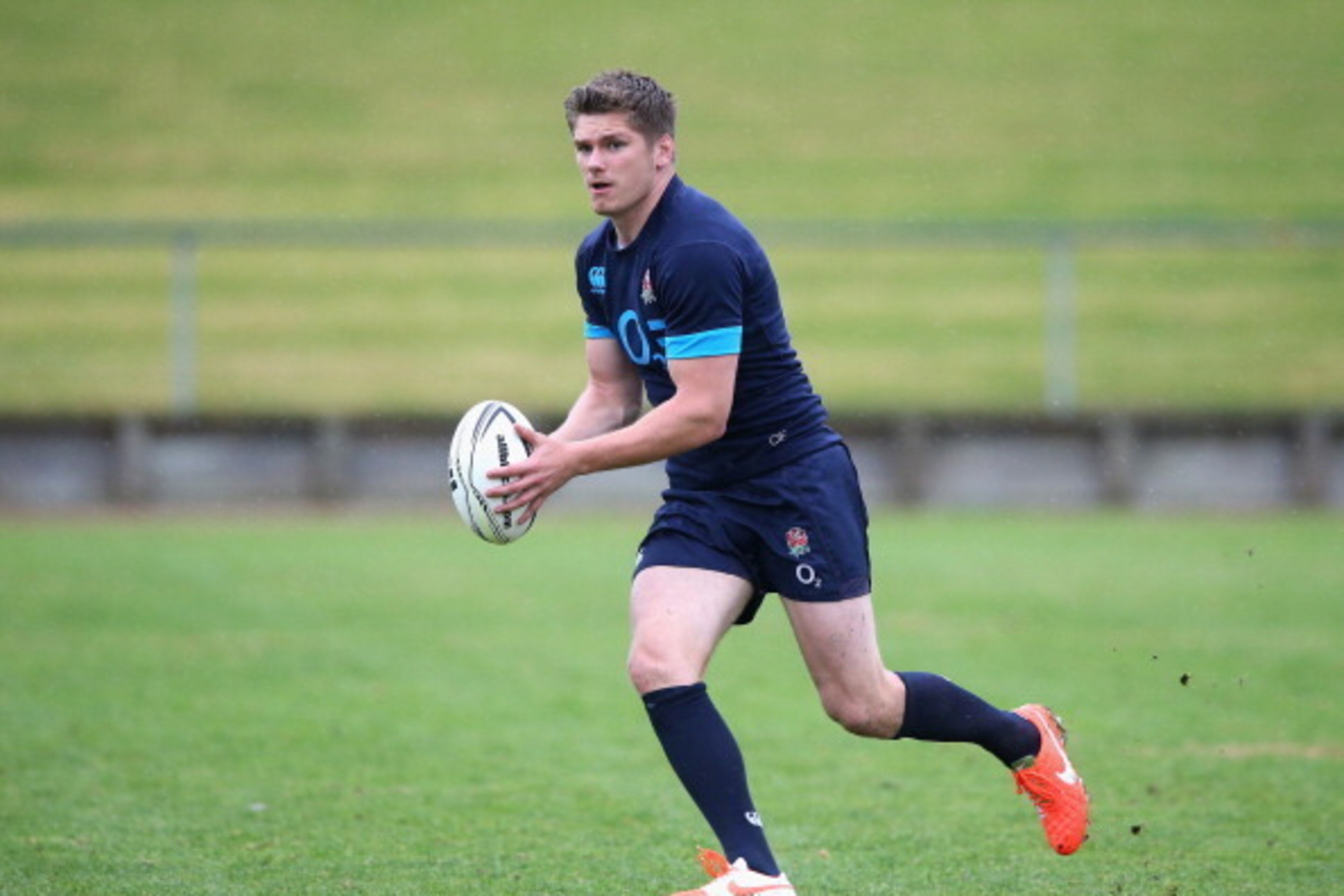 AUCKLAND, NEW ZEALAND - JUNE 09:  Owen Farrell runs with the ball during the England training session held at the Onewa Oval on June 9, 2014 in Auckland, New Zealand.  (Photo by David Rogers/Getty Images)