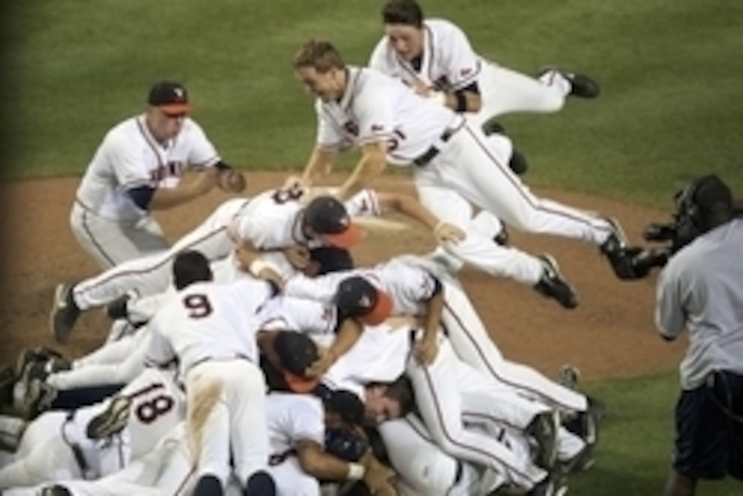 Jun 9, 2014; Charlottesville, VA, USA; The Virginia Cavaliers celebrate after defeating the Maryland Terrapins to reach the College World Series at Davenport Field. Mandatory Credit: Rafael Suanes-USA TODAY Sports