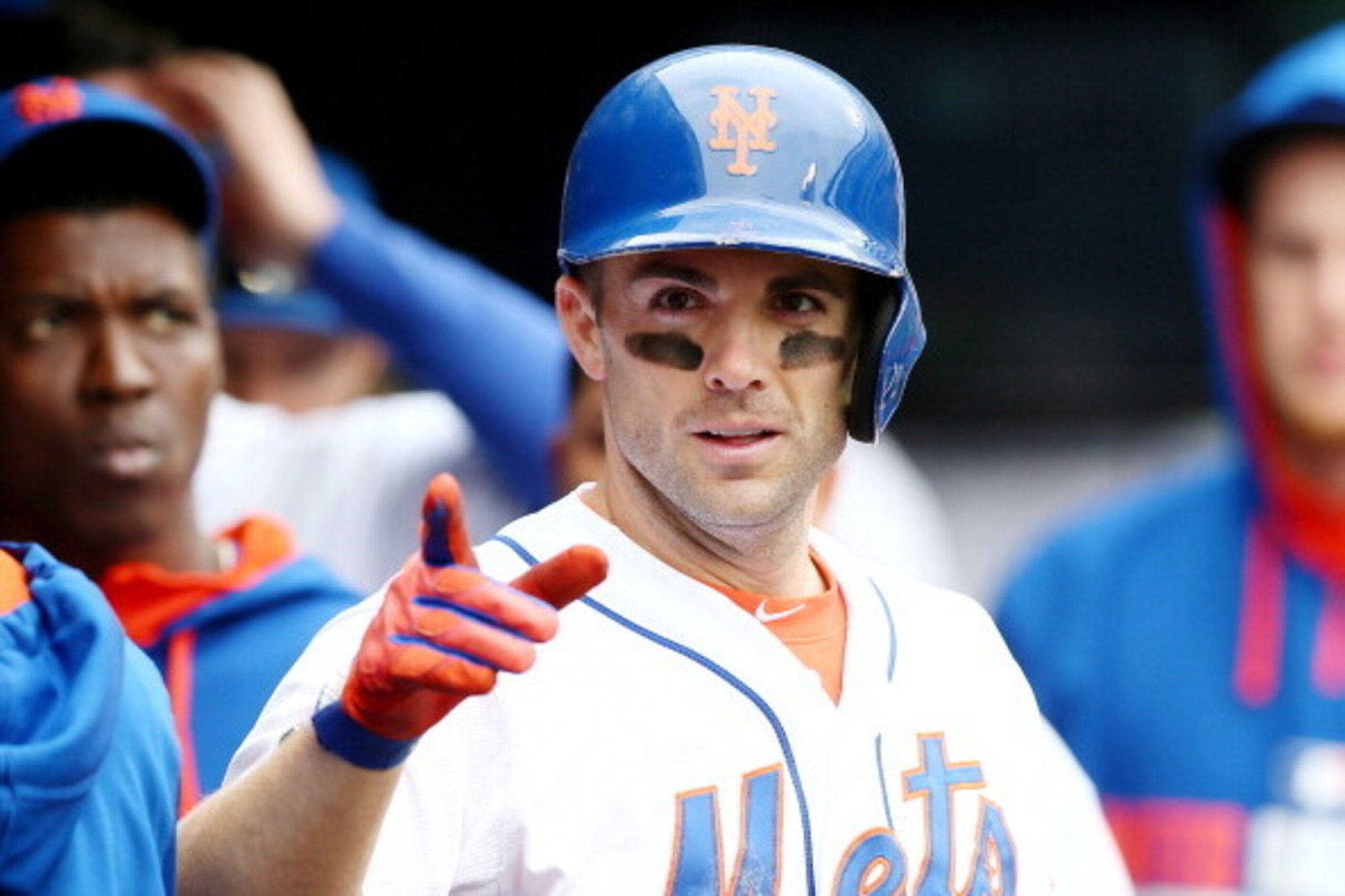 NEW YORK, NY - MAY 28:  David Wright #5 of the New York Mets celebrates in the dugout after his solo home run in the sixth inning against the Pittsburgh Pirates on May 28, 2014 at Citi Field in the Flushing neighborhood of the Queens borough of New York C