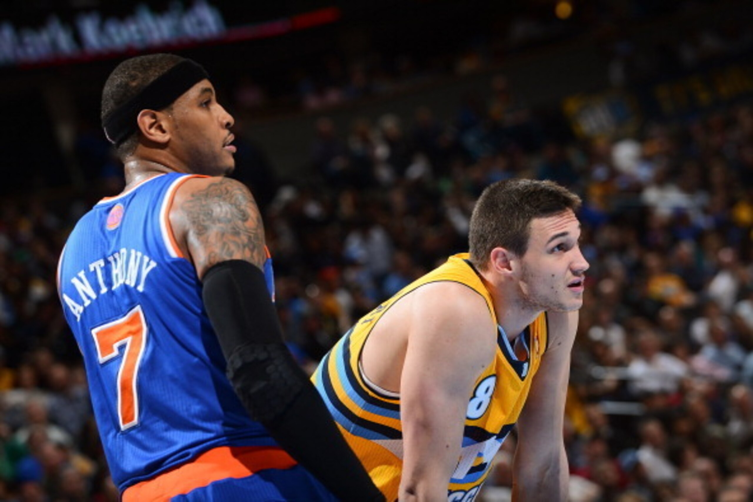 DENVER, CO - MARCH 13: Carmelo Anthony #7 of the New York Knicks and Danilo Gallinari #8 of the Denver Nuggets wait to resume play action during their game on March 13, 2013 at the Pepsi Center in Denver, Colorado. NOTE TO USER: User expressly acknowledge DENVER, CO - MARCH 13: Carmelo Anthony #7 of the New York Knicks and Danilo Gallinari #8 of the Denver Nuggets wait to resume play action during their game on March 13, 2013 at the Pepsi Center in Denver, Colorado. NOTE TO USER: User expressly acknowledge