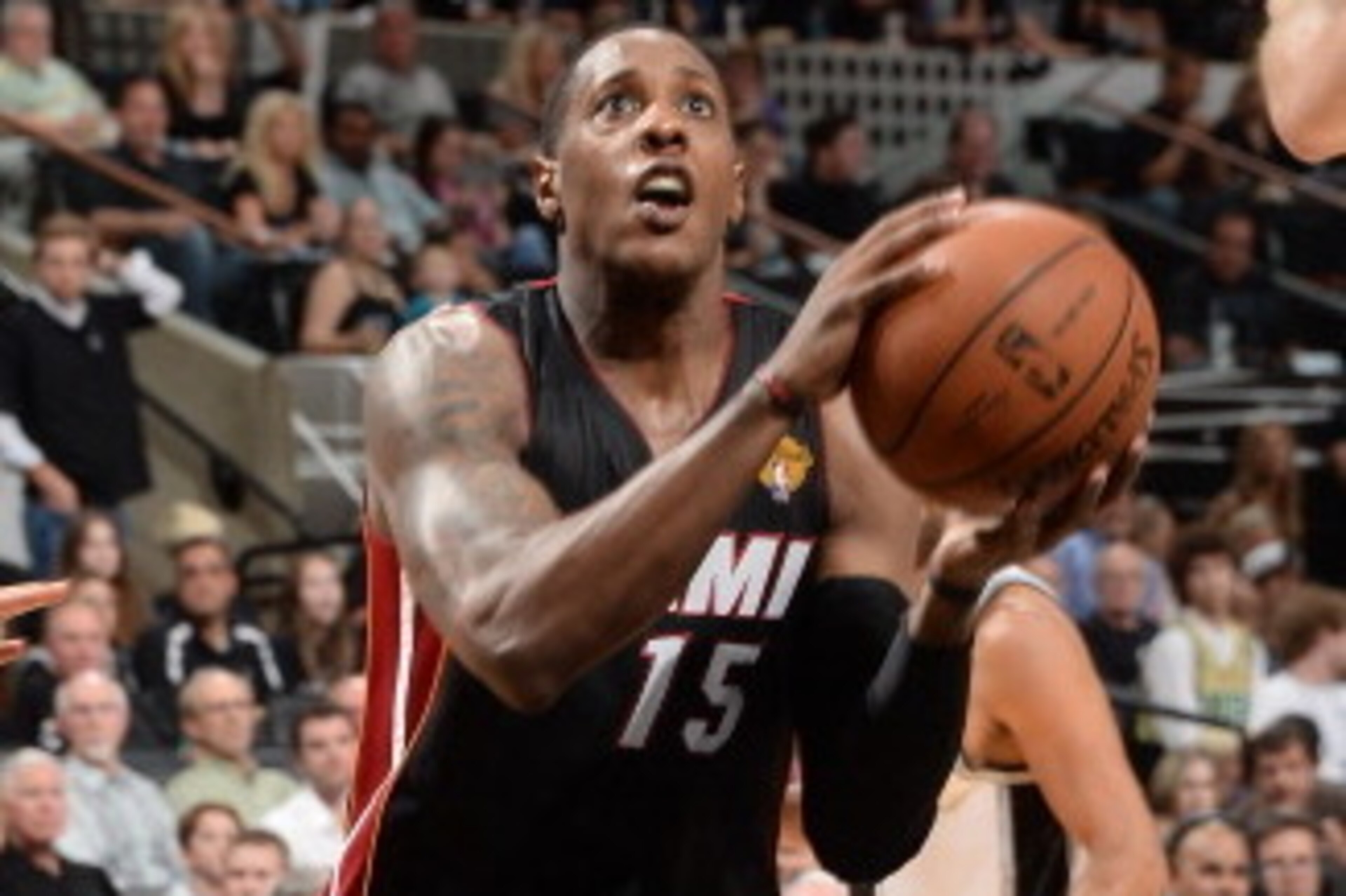 SAN ANTONIO, TX - JUNE 08: Mario Chalmers #15 of the Miami Heat drives to the basket during Game Two of the 2014 NBA Finals between the Miami Heat and San Antonio Spurs at AT&T Center on June 8, 2014 in San Antonio, Texas. NOTE TO USER: User expressly ack