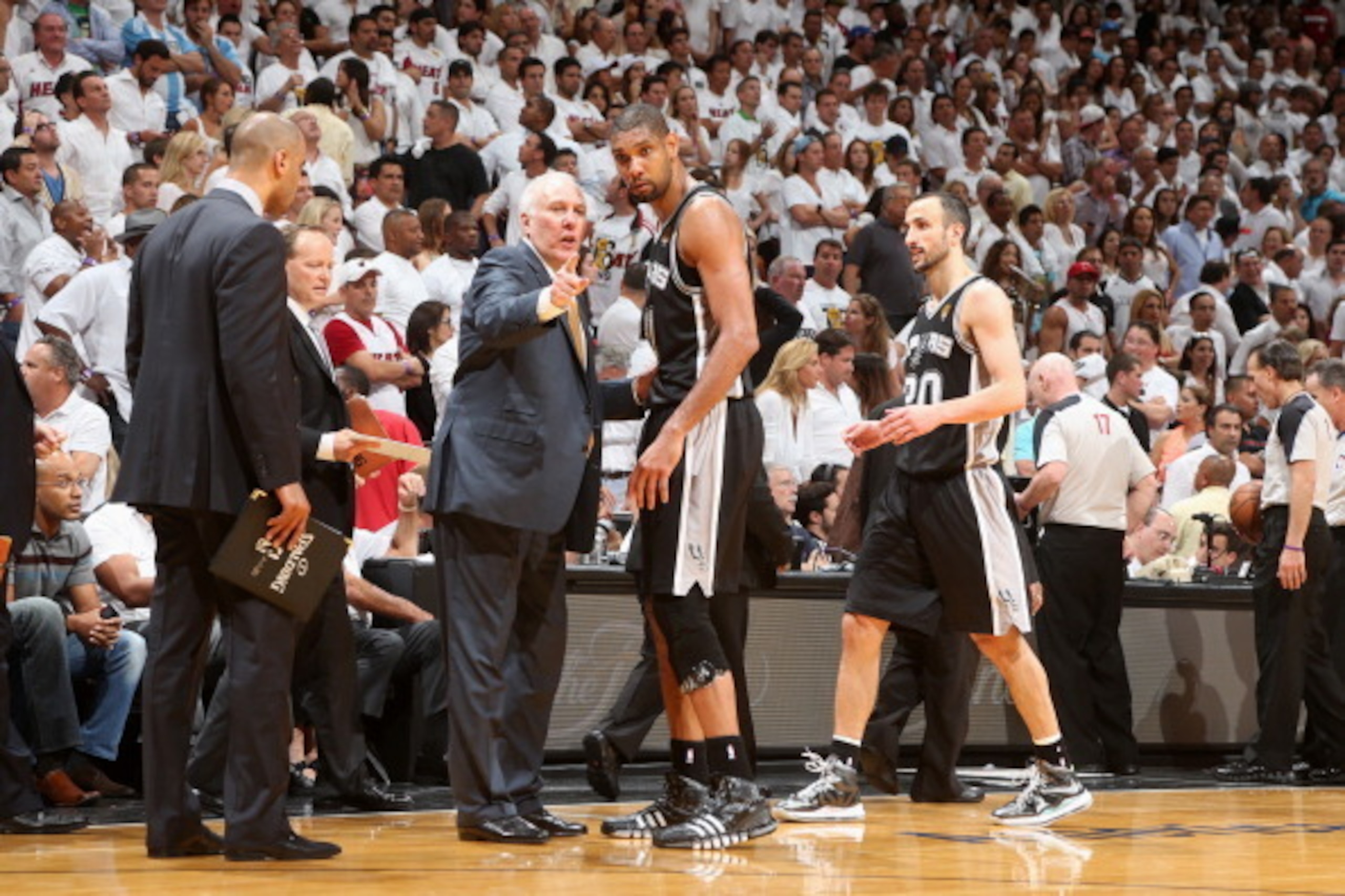 MIAMI, FL - JUNE 18: Head Coach Gregg Popovich of the San Antonio Spurs talks with Tim Duncan #21 of the San Antonio Spurs during overtime of Game Six of the 2013 NBA Finals on June 18, 2013 at American Airlines Arena in Miami, Florida. NOTE TO USER: User