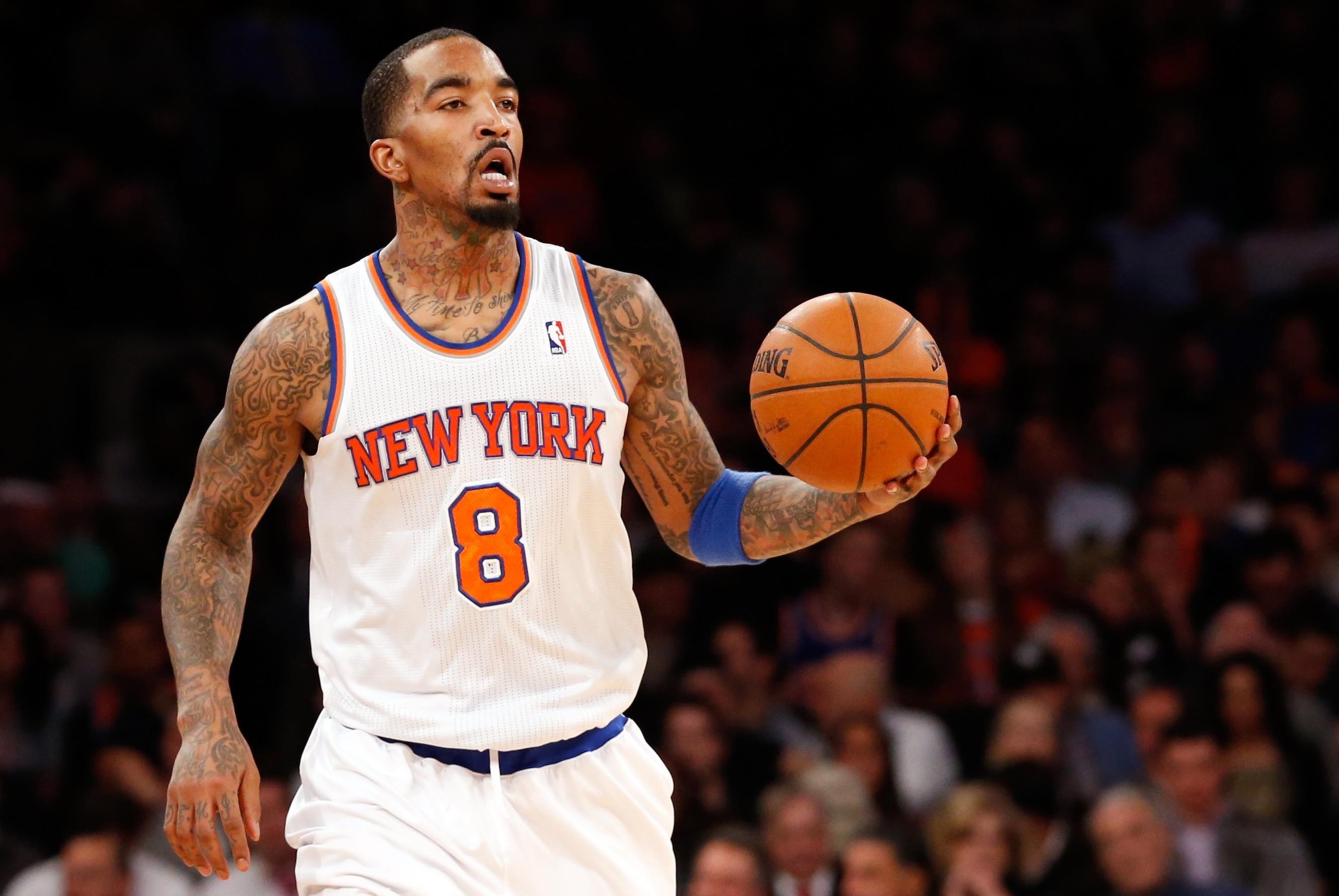 Jan 30, 2014; New York, NY, USA;  New York Knicks shooting guard J.R. Smith (8) advances the ball during the third quarter against the Cleveland Cavaliers at Madison Square Garden. New York Knicks won 117-86.  Mandatory Credit: Anthony Gruppuso-USA TODAY