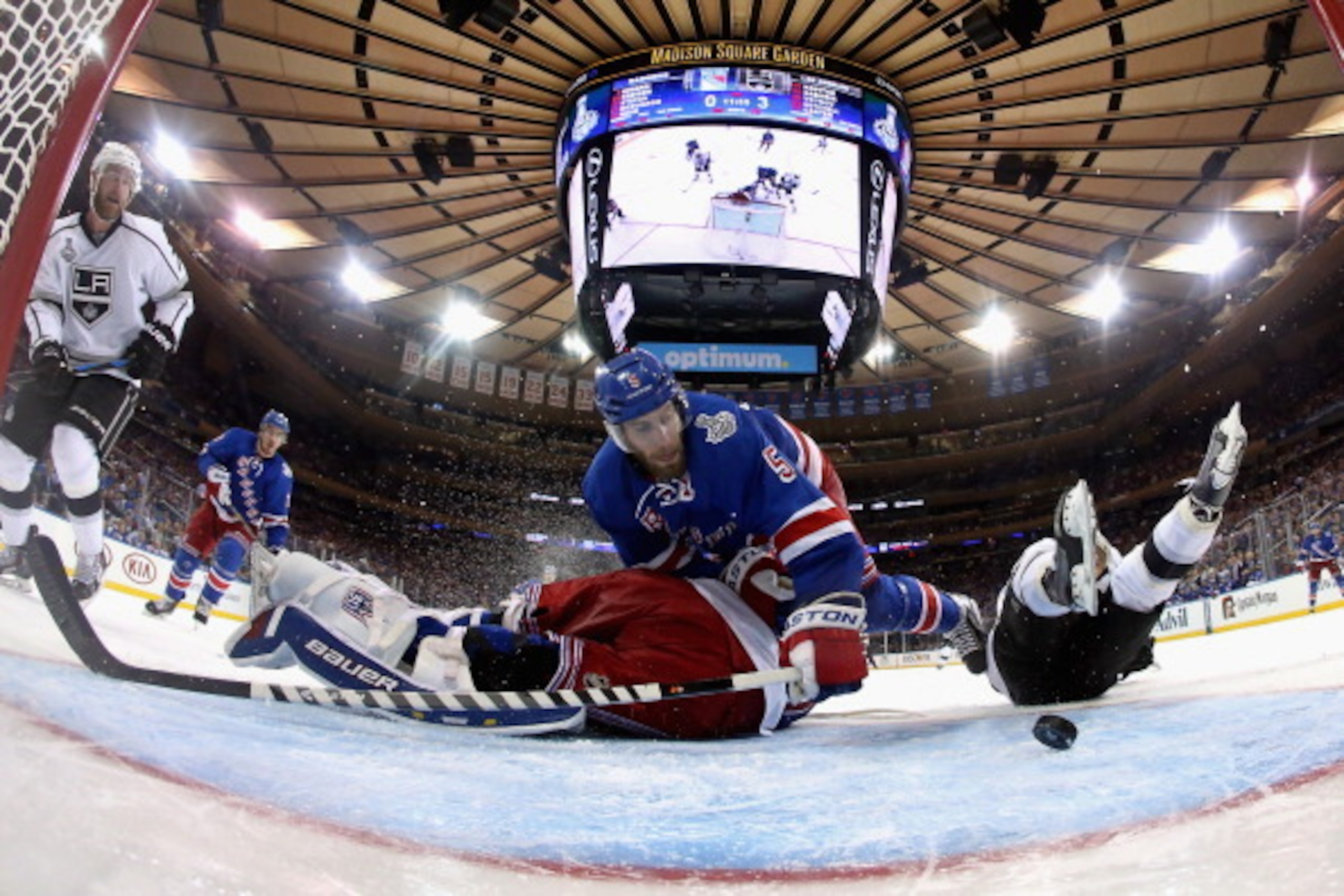 NEW YORK, NY - JUNE 09:  Dan Girardi #5 and Henrik Lundqvist #30 of the New York Rangers collide at the net as Girardi tries to make a play away from Marian Gaborik #12 of the Los Angeles Kings during the third period of Game Three of the 2014 NHL Stanley