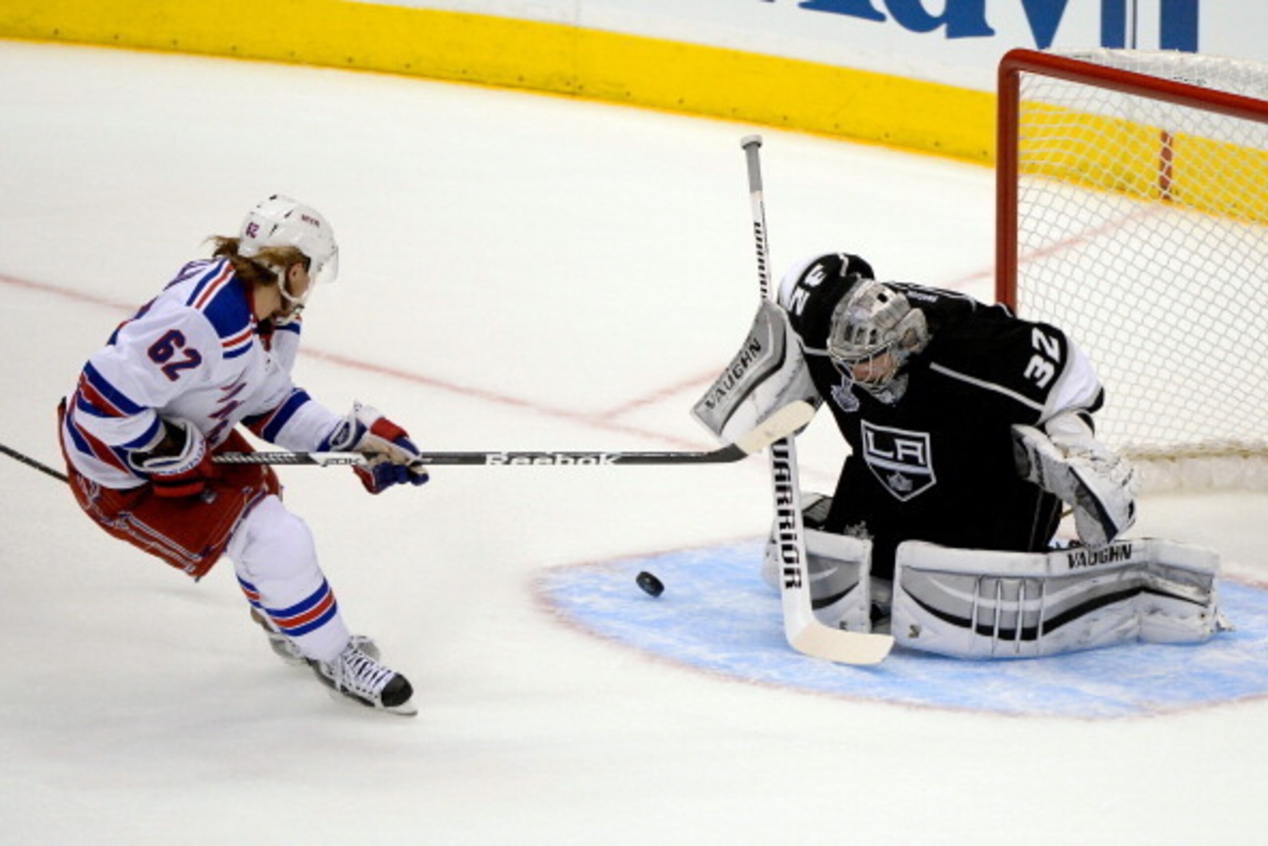 LOS ANGELES, CA - JUNE 04:  Carl Hagelin #62 of the New York Rangers scores a goal in the first period against goaltender Jonathan Quick #32 of the Los Angeles Kings during Game One of the 2014 NHL Stanley Cup Final at the Staples Center on June 4, 2014 i