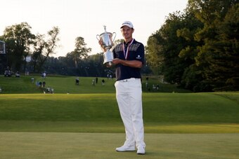 ARDMORE, PA - JUNE 16:  Justin Rose of England celebrates with the U.S. Open trophy after winning the 113th U.S. Open at Merion Golf Club on June 16, 2013 in Ardmore, Pennsylvania.  (Photo by Rob Carr/Getty Images)