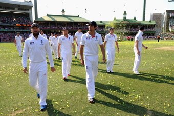 SYDNEY, AUSTRALIA - JANUARY 05:  England captain Alastair Cook leads his team from the field as Australia celebrate winning the ashes at the end of day three of the Fifth Ashes Test match between Australia and England at Sydney Cricket Ground on January 5