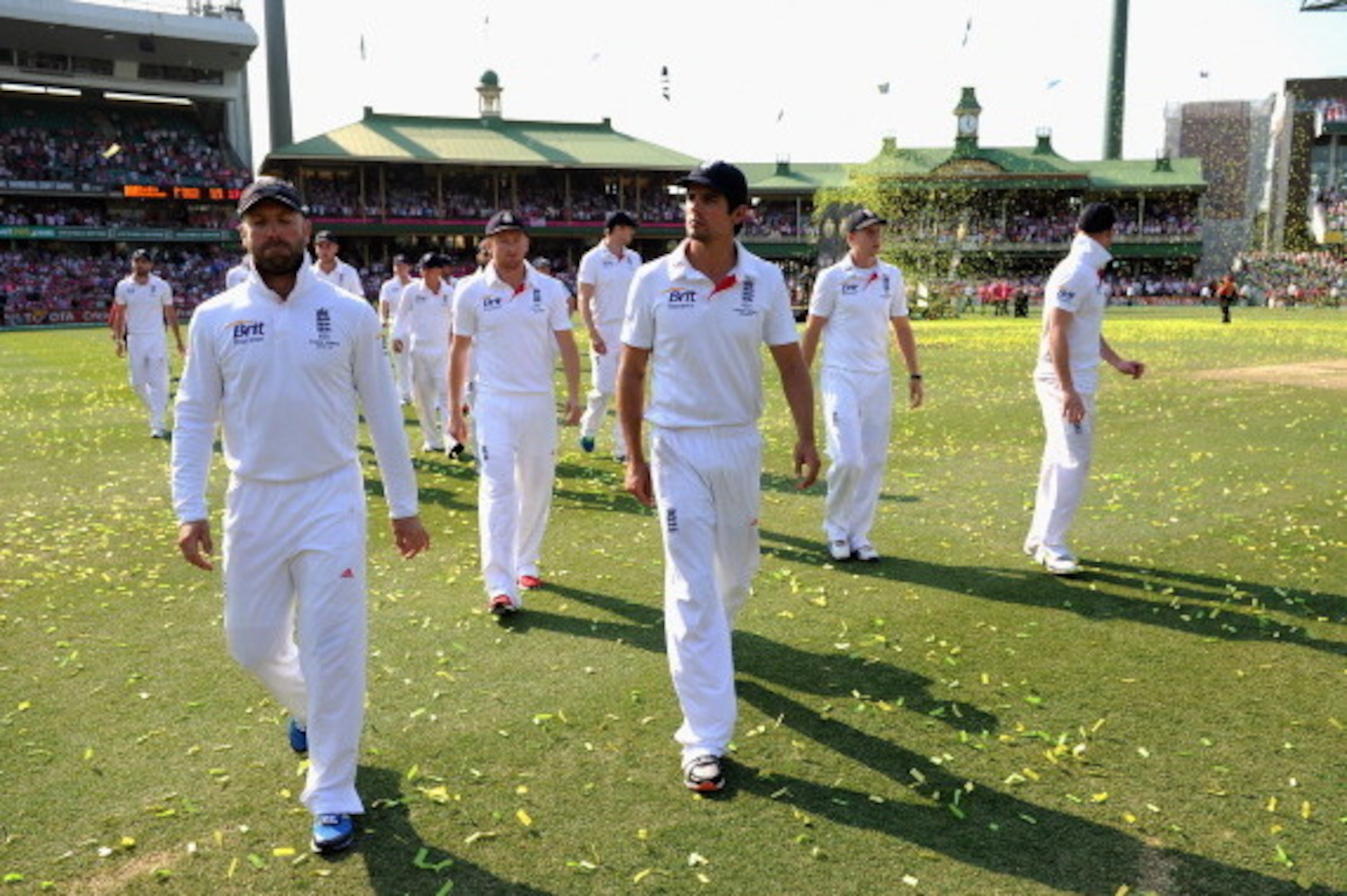 SYDNEY, AUSTRALIA - JANUARY 05: England captain Alastair Cook leads his team from the field as Australia celebrate winning the ashes at the end of day three of the Fifth Ashes Test match between Australia and England at Sydney Cricket Ground on January 5 SYDNEY, AUSTRALIA - JANUARY 05: England captain Alastair Cook leads his team from the field as Australia celebrate winning the ashes at the end of day three of the Fifth Ashes Test match between Australia and England at Sydney Cricket Ground on January 5
