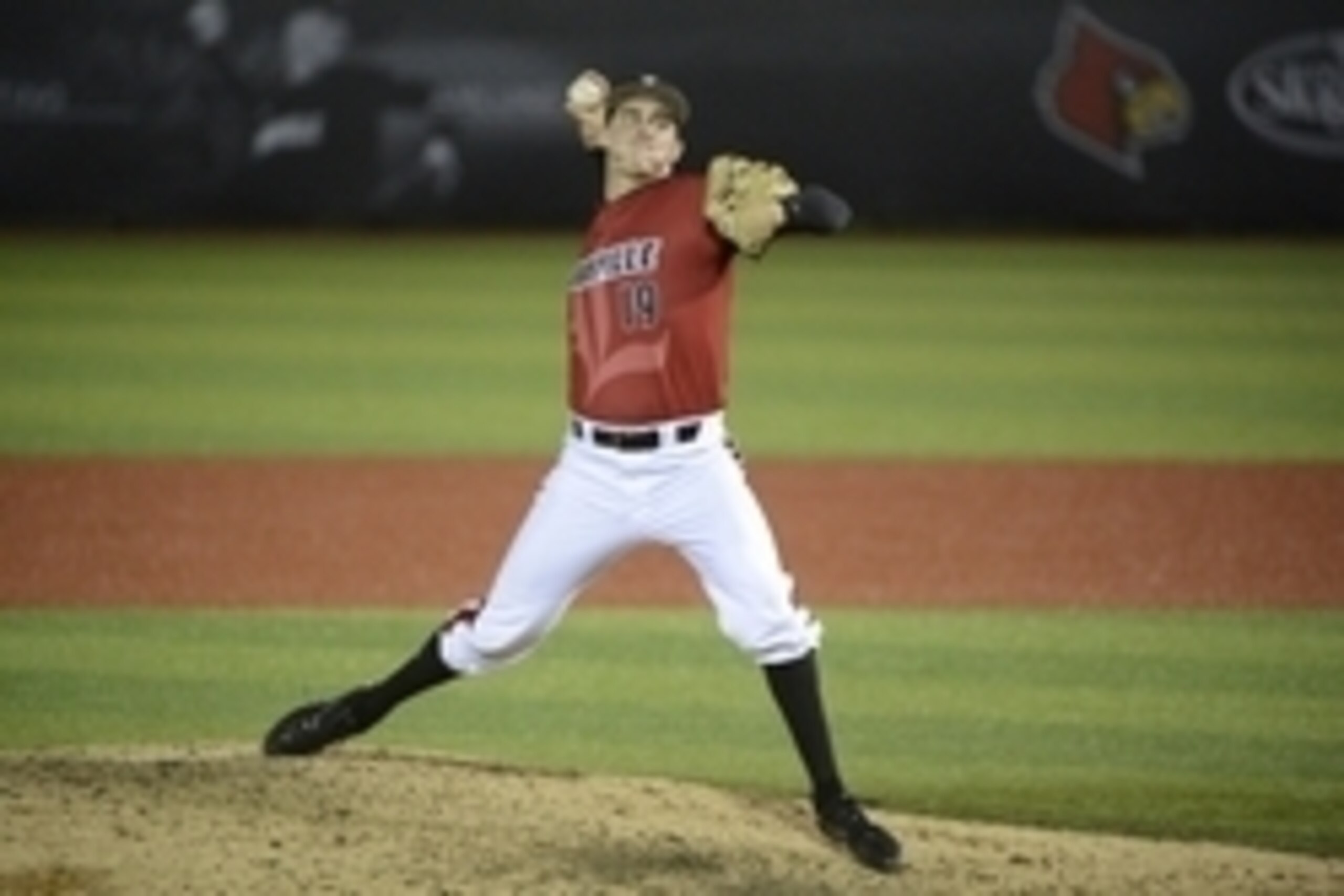 Jun 7, 2014; Louisville, KY, USA; Louisville Cardinals pitcher Nick Burdi (19) throws a pitch to a Kennesaw State Owls batter in the bottom of the ninth inning at Jim Patterson Stadium. Louisville defeated Kennesaw State 7-4.  Mandatory Credit: Jamie Rhod