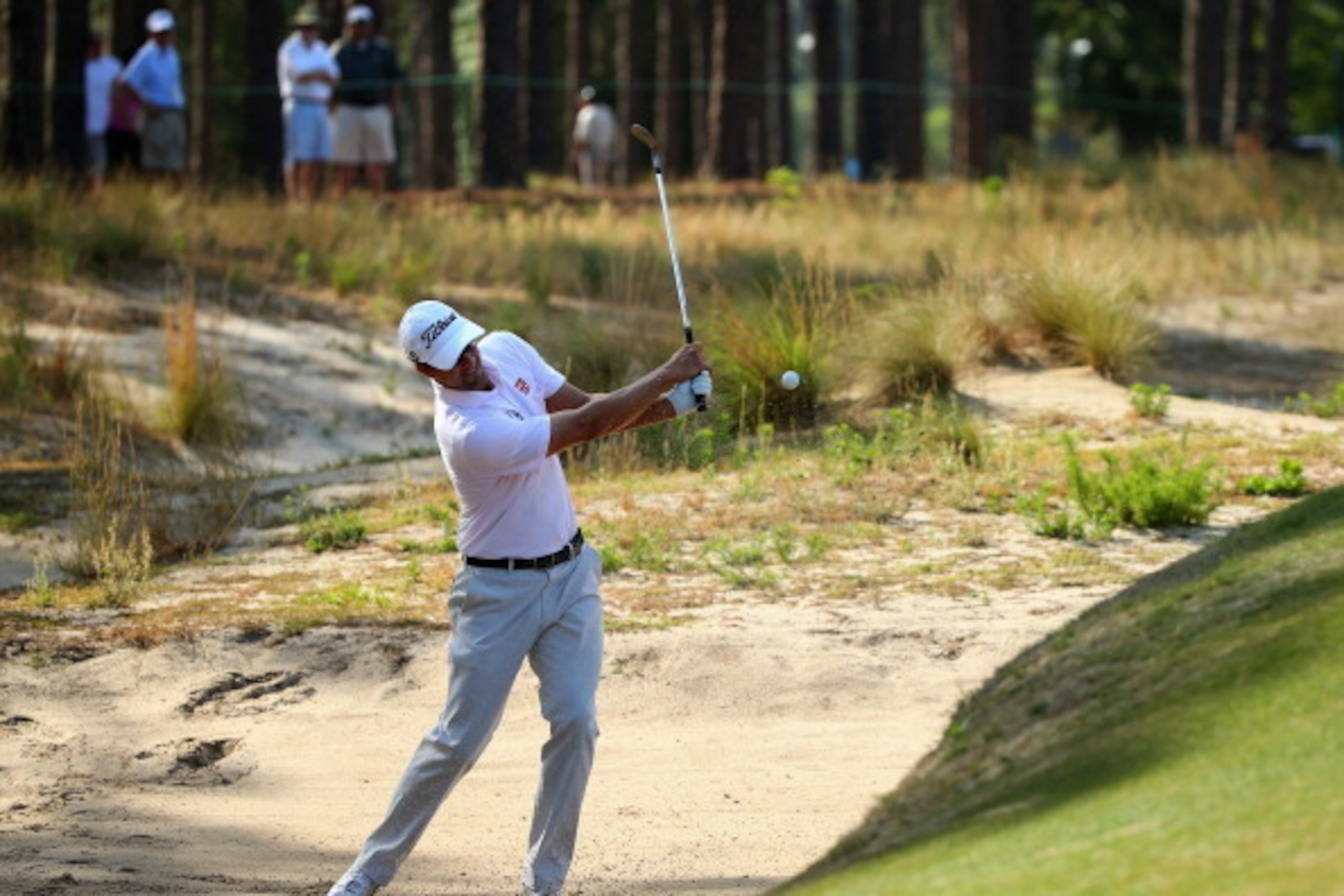 PINEHURST, NC - JUNE 10: Adam Scott of Australia hits a shot from a bunker during a practice round prior to the start of the 114th U.S. Open at Pinehurst Resort & Country Club, Course No. 2 on June 10, 2014 in Pinehurst, North Carolina. (Photo by Mike E PINEHURST, NC - JUNE 10: Adam Scott of Australia hits a shot from a bunker during a practice round prior to the start of the 114th U.S. Open at Pinehurst Resort & Country Club, Course No. 2 on June 10, 2014 in Pinehurst, North Carolina. (Photo by Mike E
