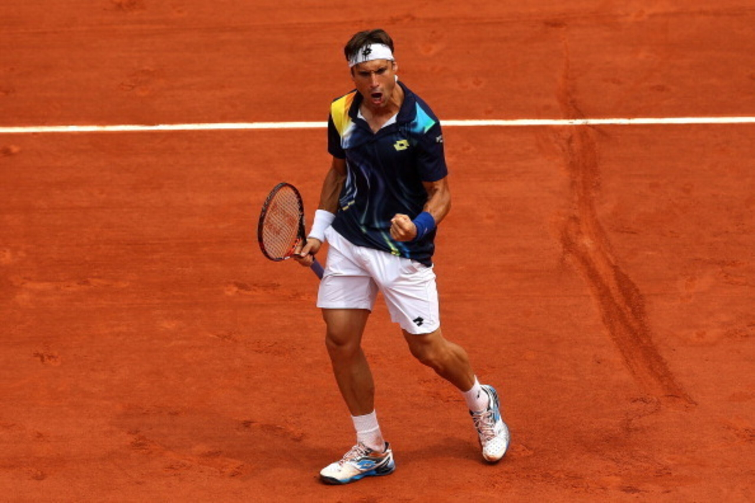 PARIS, FRANCE - JUNE 02:  David Ferrer of Spain celebrates a point during his men's singles match against Kevin Anderson of South Africa on day nine of the French Open at Roland Garros on June 2, 2014 in Paris, France.  (Photo by Matthew Stockman/Getty Im