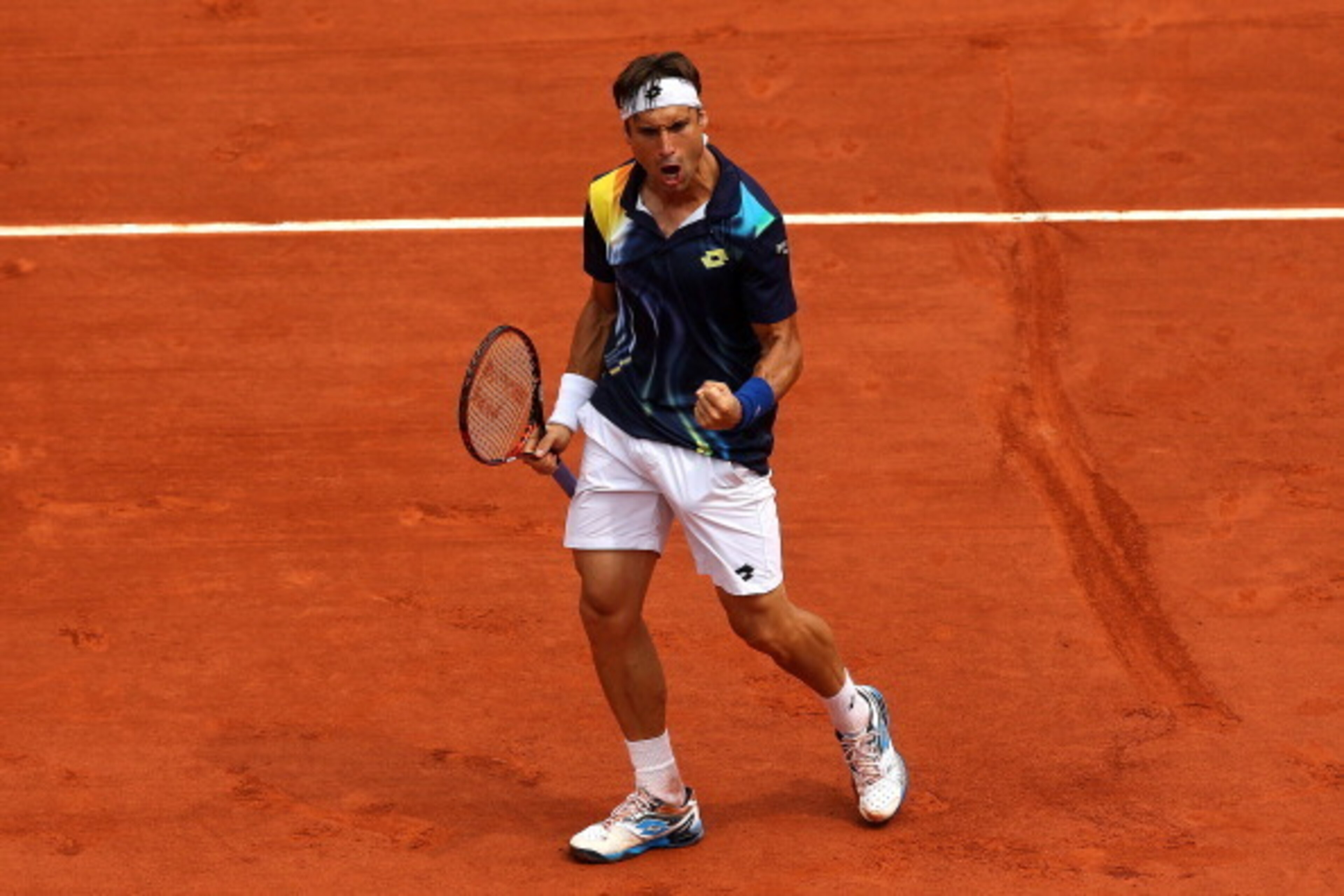 PARIS, FRANCE - JUNE 02:  David Ferrer of Spain celebrates a point during his men's singles match against Kevin Anderson of South Africa on day nine of the French Open at Roland Garros on June 2, 2014 in Paris, France.  (Photo by Matthew Stockman/Getty Im