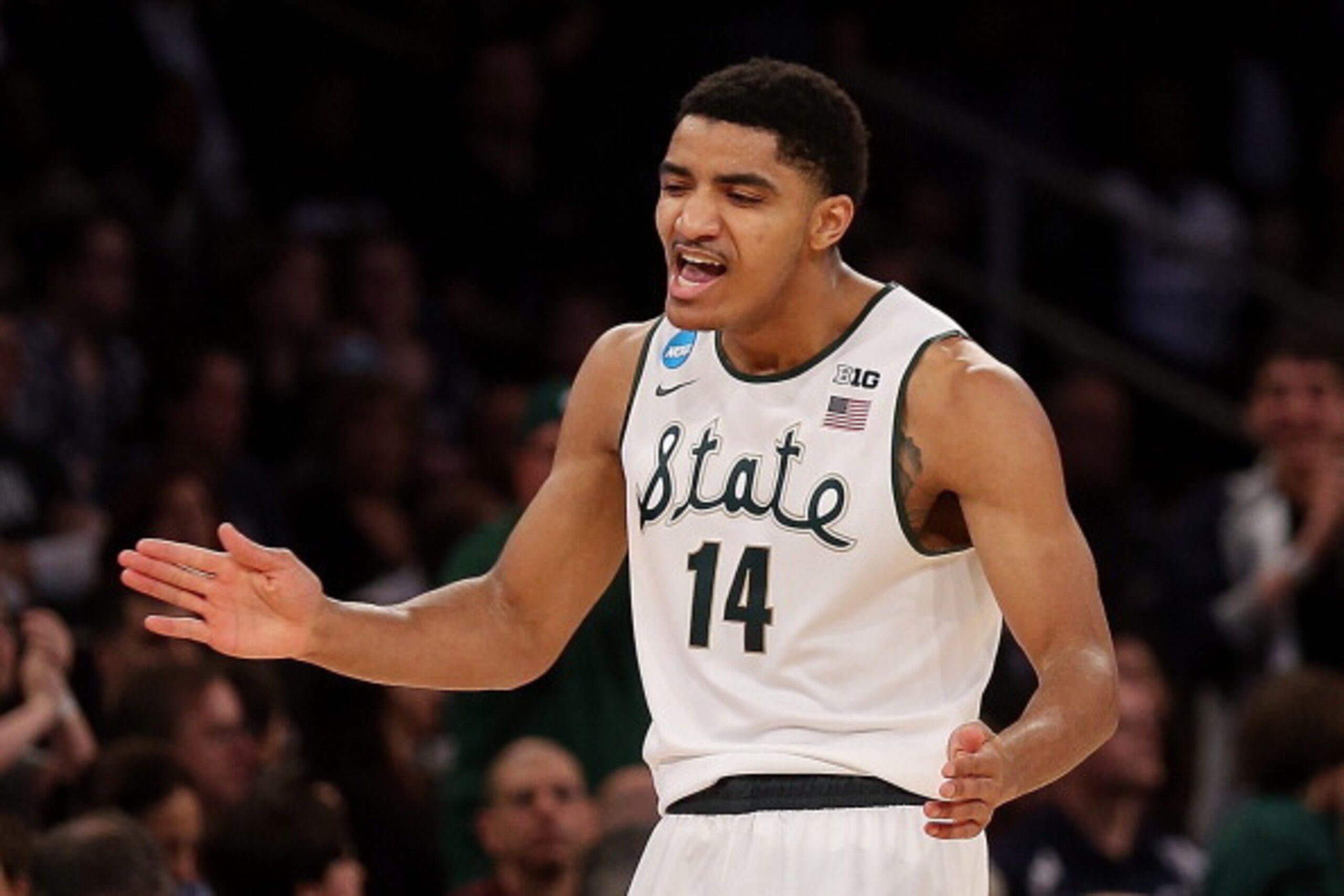 NEW YORK, NY - MARCH 30:  Gary Harris #14 of the Michigan State Spartans reacts after hitting a three pointer late in the first half against the Connecticut Huskies during the East Regional Final of the 2014 NCAA Men's Basketball Tournament at Madison Squ