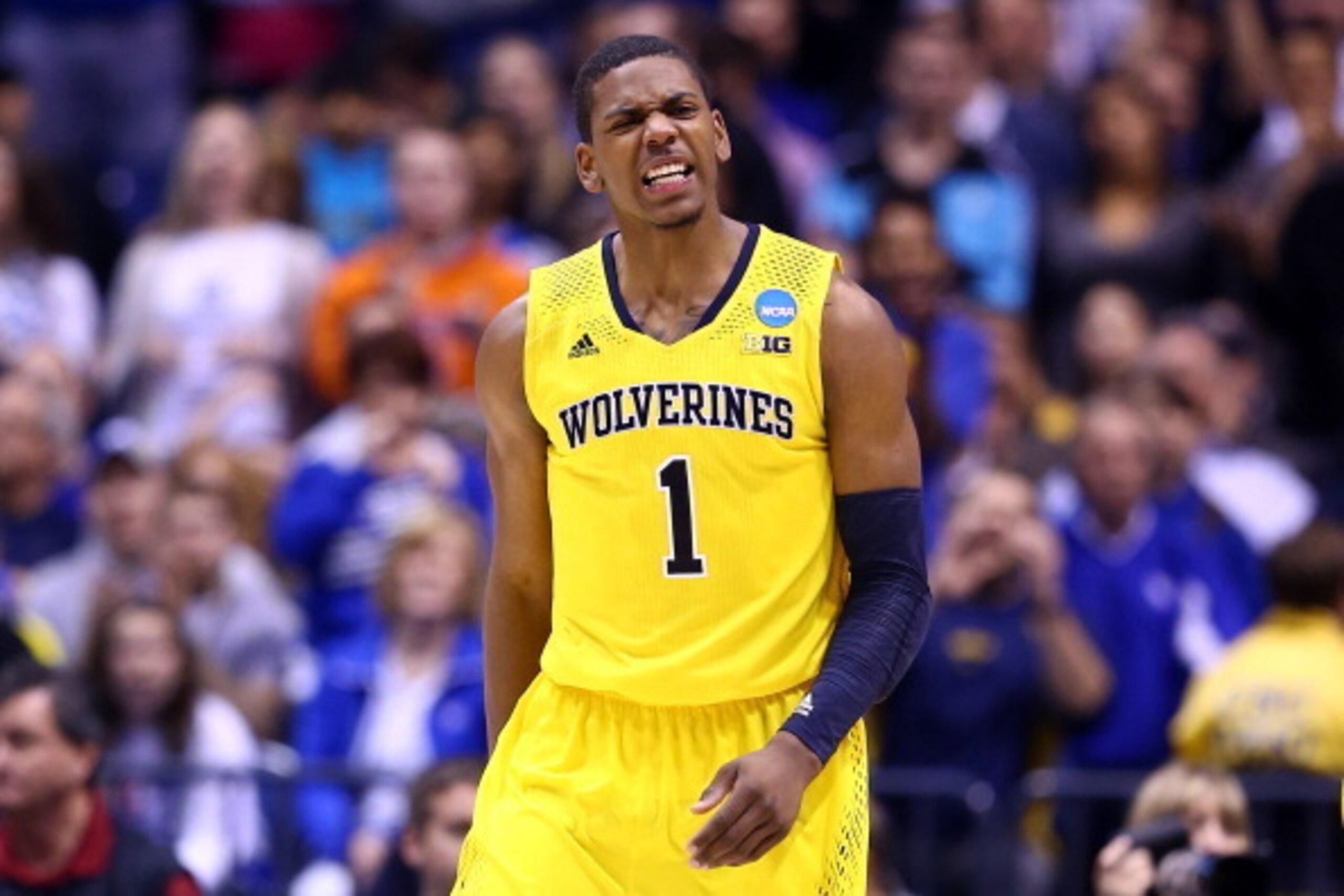 INDIANAPOLIS, IN - MARCH 30:  Glenn Robinson III #1 of the Michigan Wolverines reacts against the Kentucky Wildcats during the midwest regional final of the 2014 NCAA Men's Basketball Tournament at Lucas Oil Stadium on March 30, 2014 in Indianapolis, Indi
