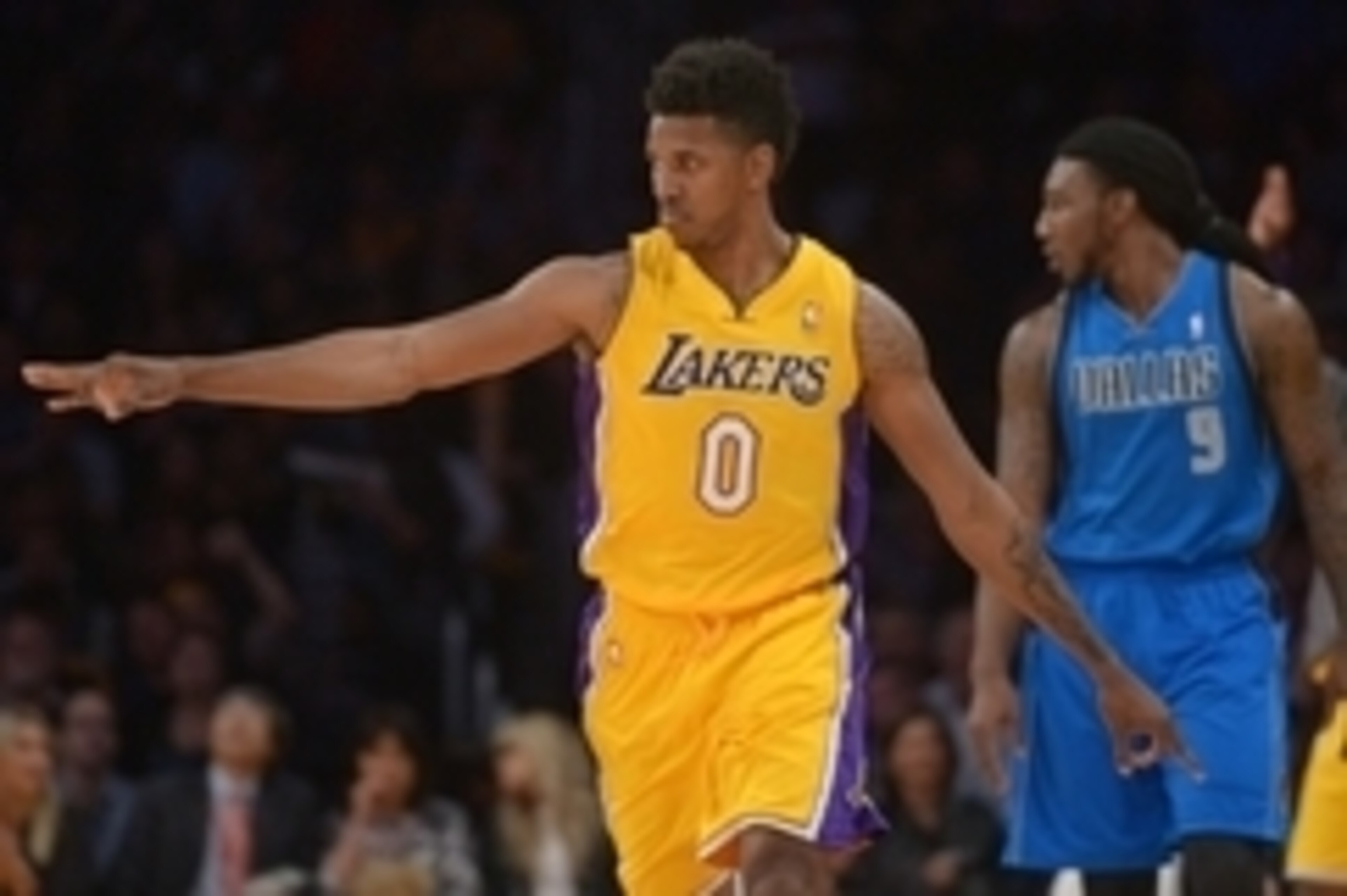 Apr 4, 2014; Los Angeles, CA, USA; Los Angeles Lakers guard Nick Young (0) reacts after a 3-point basket as Dallas Mavericks forward Jae Crowder (9) watches at Staples Center. Mandatory Credit: Kirby Lee-USA TODAY Sports Apr 4, 2014; Los Angeles, CA, USA; Los Angeles Lakers guard Nick Young (0) reacts after a 3-point basket as Dallas Mavericks forward Jae Crowder (9) watches at Staples Center. Mandatory Credit: Kirby Lee-USA TODAY Sports