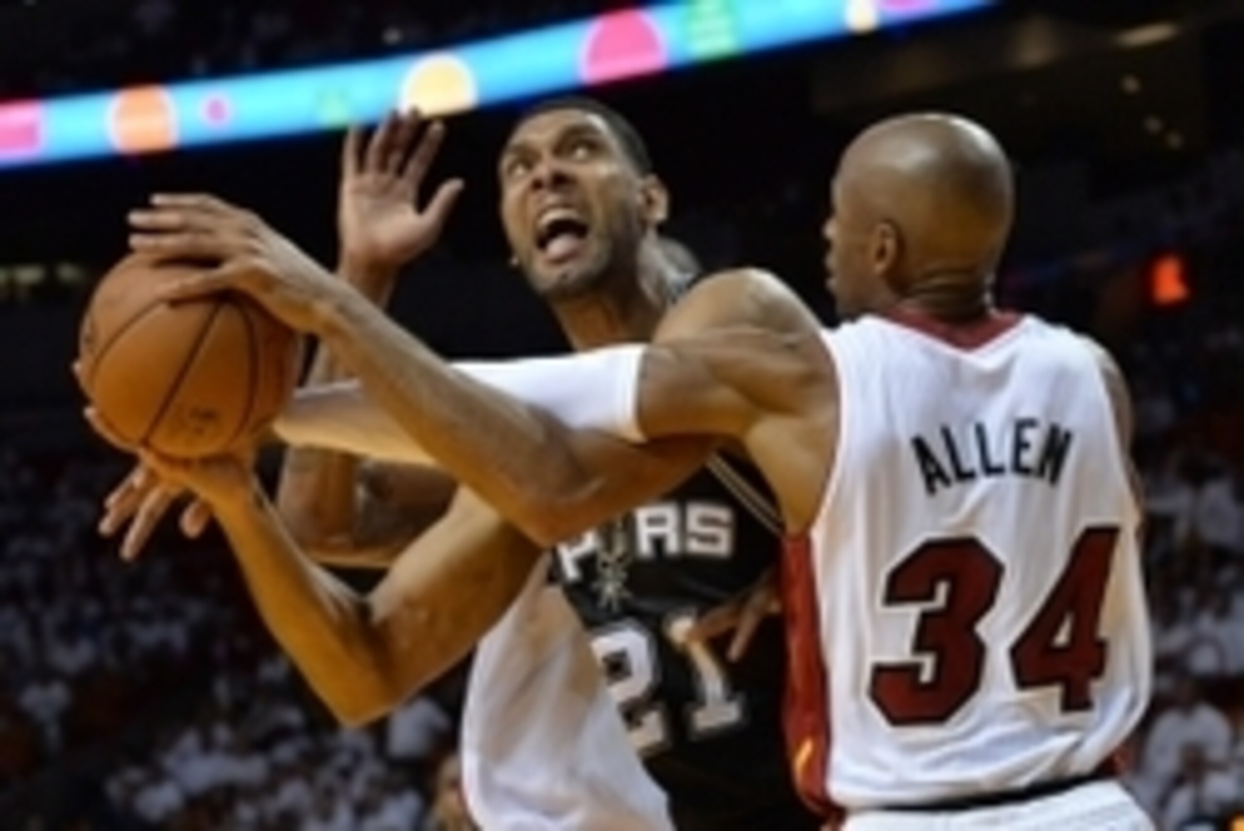 Jun 10, 2014; Miami, FL, USA; San Antonio Spurs forward Tim Duncan (21) drives against Miami Heat guard Ray Allen (34) during the fourth quarter of game three of the 2014 NBA Finals at American Airlines Arena. San Antonio Spurs won 111-92. Mandatory Credi Jun 10, 2014; Miami, FL, USA; San Antonio Spurs forward Tim Duncan (21) drives against Miami Heat guard Ray Allen (34) during the fourth quarter of game three of the 2014 NBA Finals at American Airlines Arena. San Antonio Spurs won 111-92. Mandatory Credi