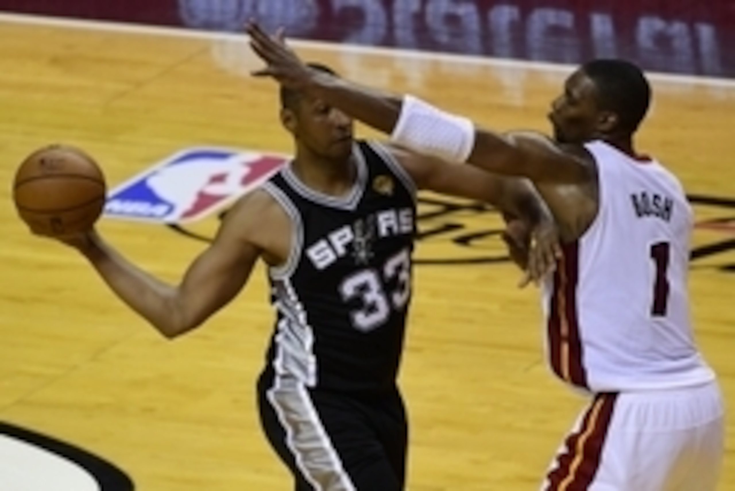 Jun 10, 2014; Miami, FL, USA; San Antonio Spurs forward Boris Diaw (33) passes around Miami Heat center Chris Bosh (1) during the second half of game three of the 2014 NBA Finals at American Airlines Arena. Mandatory Credit: Bob Donnan-USA TODAY Sports Jun 10, 2014; Miami, FL, USA; San Antonio Spurs forward Boris Diaw (33) passes around Miami Heat center Chris Bosh (1) during the second half of game three of the 2014 NBA Finals at American Airlines Arena. Mandatory Credit: Bob Donnan-USA TODAY Sports
