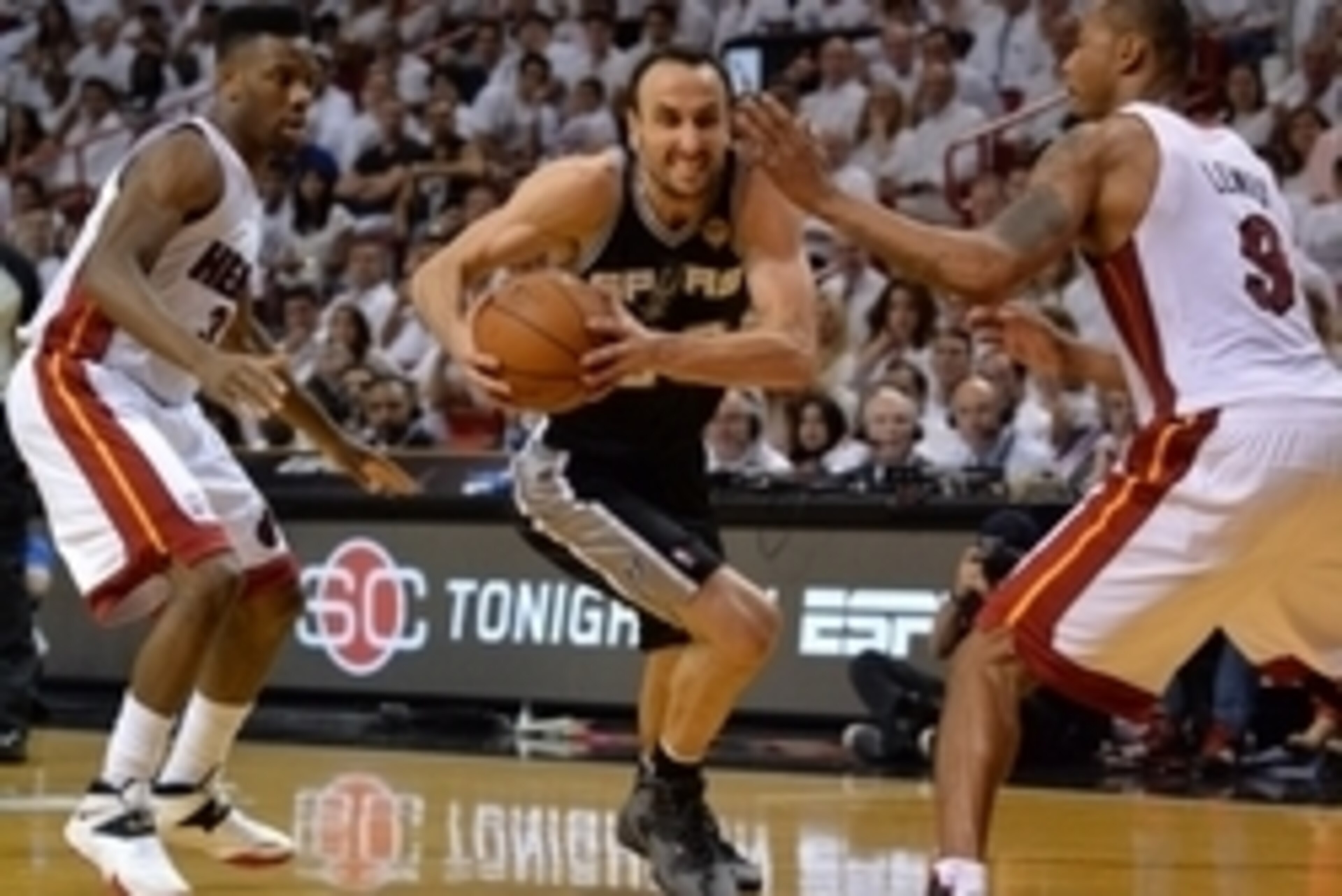 Jun 10, 2014; Miami, FL, USA; San Antonio Spurs guard Manu Ginobili (20) drives against Miami Heat guard Norris Cole (left) and forward Rashard Lewis (9) during the third quarter of game three of the 2014 NBA Finals at American Airlines Arena. Mandatory C
