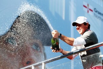 VIRGINIA WATER, ENGLAND - MAY 25:  Rory McIlroy of Northern Ireland sprays champagne following his victory at the end of day four of the BMW PGA Championship at Wentworth on May 25, 2014 in Virginia Water, England.  (Photo by Andrew Redington/Getty Images