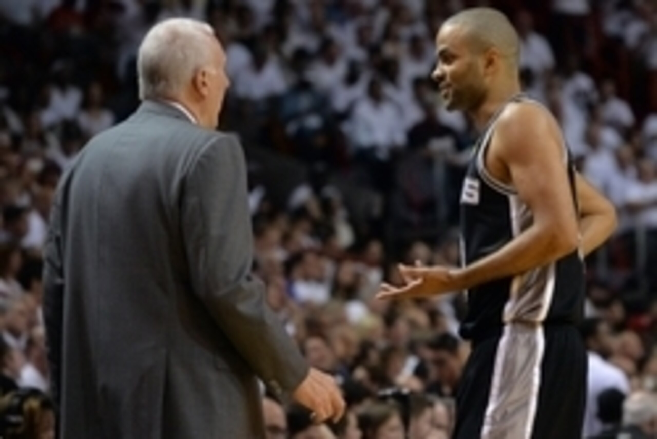 Jun 10, 2014; Miami, FL, USA; San Antonio Spurs guard Tony Parker (9) talks with head coach Gregg Popovich during the first half of game three of the 2014 NBA Finals against the Miami Heat at American Airlines Arena. Mandatory Credit: Steve Mitchell-USA T Jun 10, 2014; Miami, FL, USA; San Antonio Spurs guard Tony Parker (9) talks with head coach Gregg Popovich during the first half of game three of the 2014 NBA Finals against the Miami Heat at American Airlines Arena. Mandatory Credit: Steve Mitchell-USA T