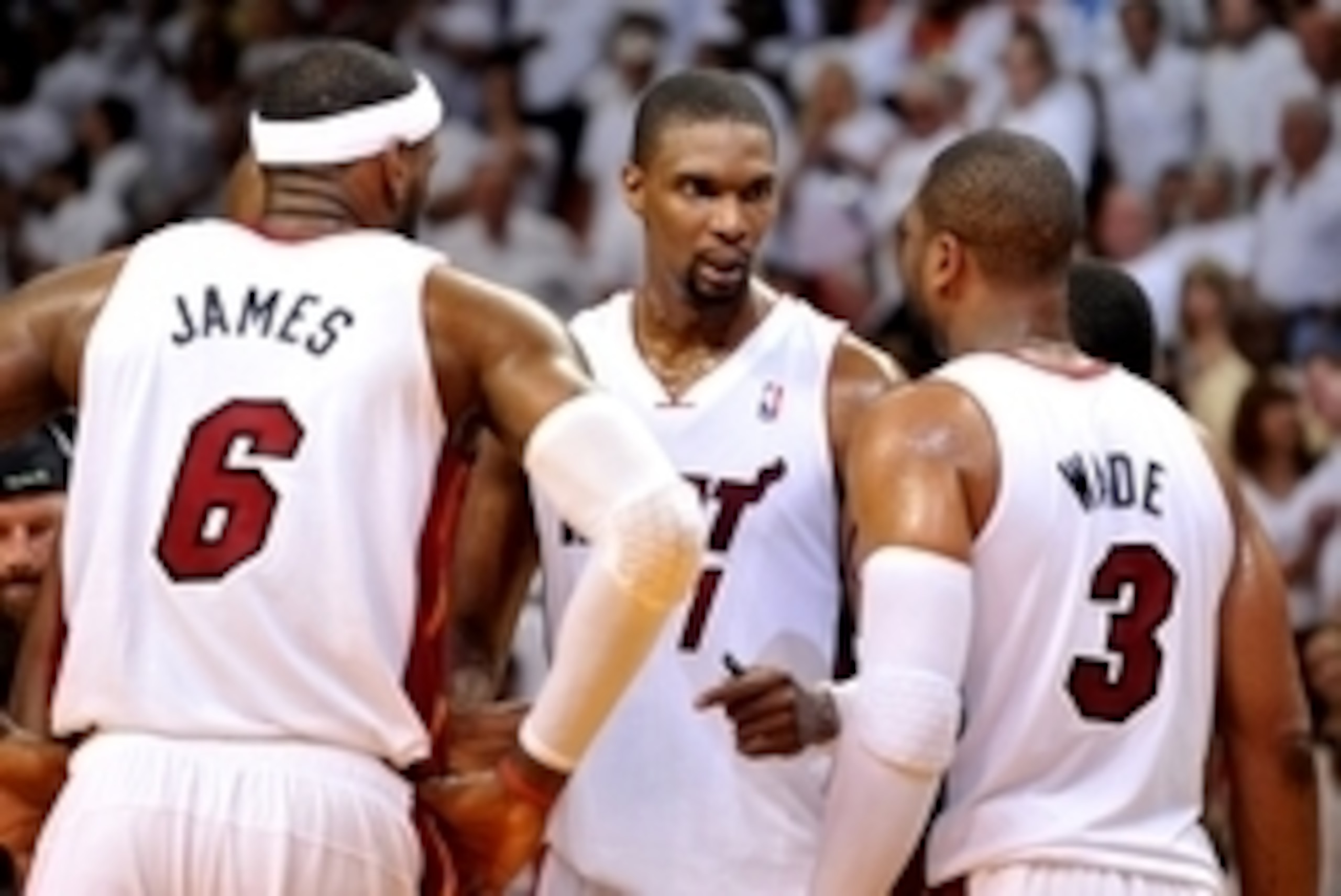 May 8, 2014; Miami, FL, USA; Miami Heat forward LeBron James (left) talks with center Chris Bosh (center) and guard Dwyane Wade (right) during the second half in game two of the second round of the 2014 NBA Playoffs against the Brooklyn Nets at American May 8, 2014; Miami, FL, USA; Miami Heat forward LeBron James (left) talks with center Chris Bosh (center) and guard Dwyane Wade (right) during the second half in game two of the second round of the 2014 NBA Playoffs against the Brooklyn Nets at American