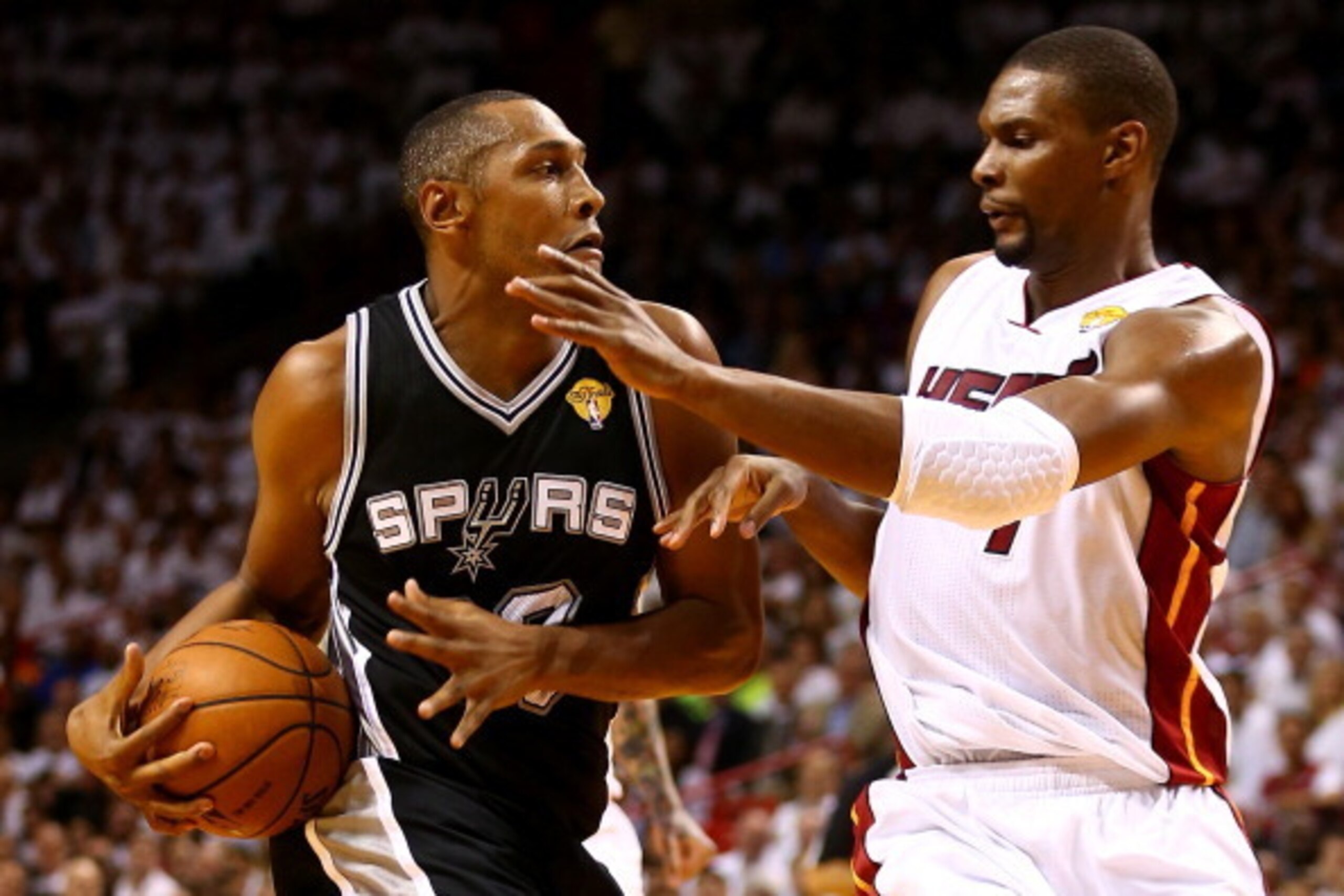 MIAMI, FL - JUNE 10: Boris Diaw #33 of the San Antonio Spurs drives to the basket against Chris Bosh #1 of the Miami Heat during Game Three of the 2014 NBA Finals at American Airlines Arena on June 10, 2014 in Miami, Florida. NOTE TO USER: User expressly 
