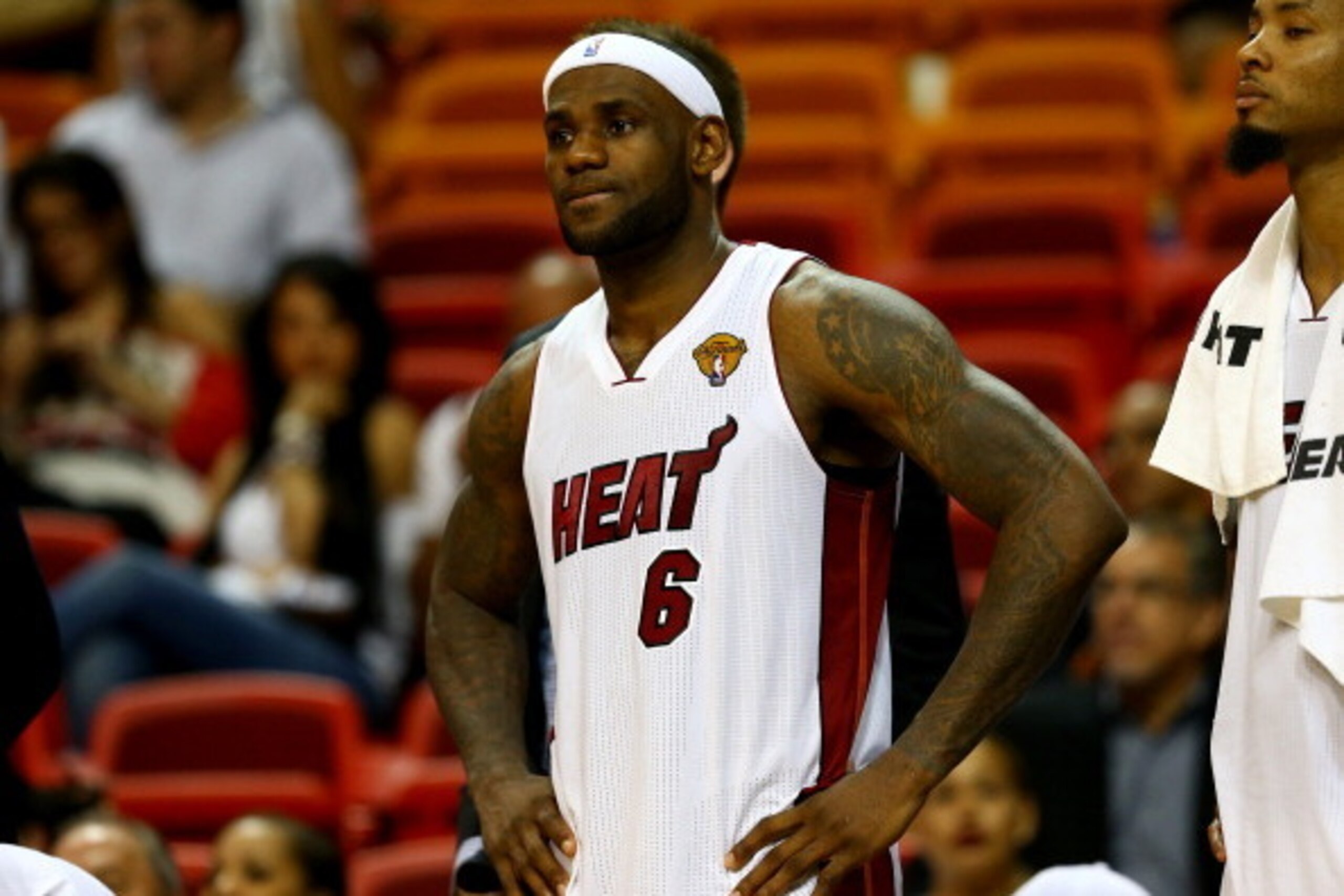 MIAMI, FL - JUNE 10:  LeBron James #6 of the Miami Heat reacts on the bench against the San Antonio Spurs during Game Three of the 2014 NBA Finals at American Airlines Arena on June 10, 2014 in Miami, Florida. The San Antonio Spurs defeated the Miami Heat