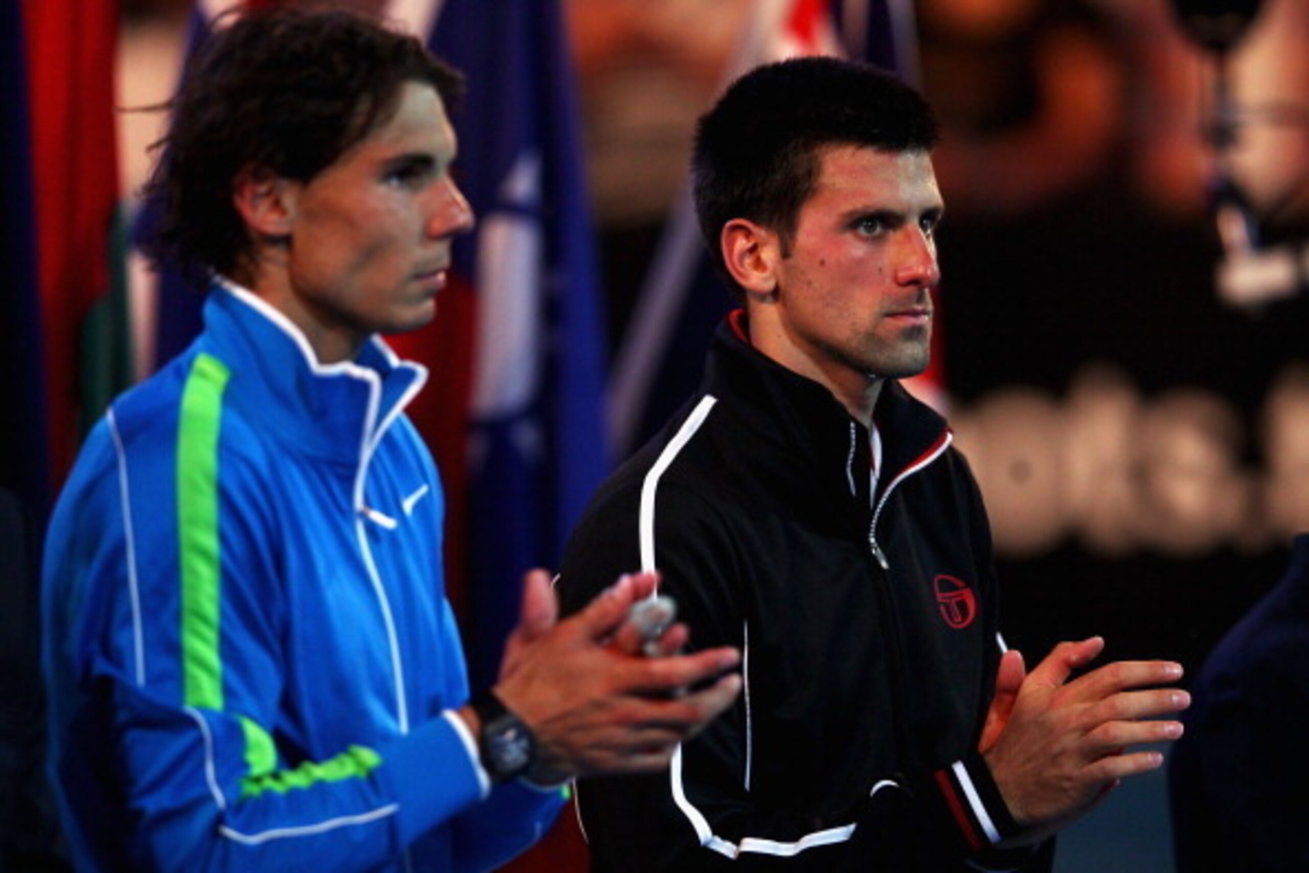 MELBOURNE, AUSTRALIA - JANUARY 29:  Rafael Nadal of Spain and Novak Djokovic of Serbia applaud during the presentation ceremony after Djokovic won the men's final match against  during day fourteen of the 2012 Australian Open at Melbourne Park on January 