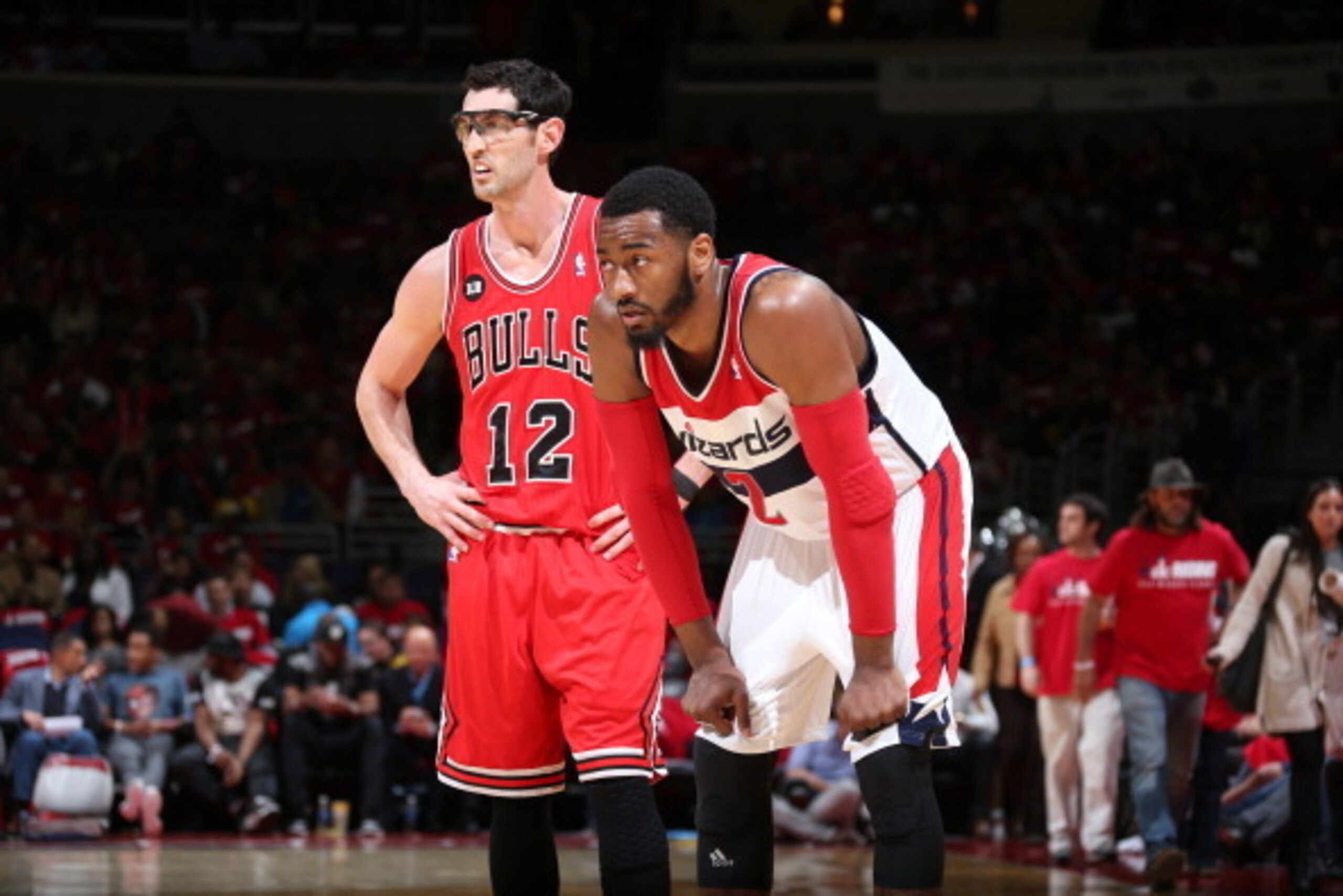 WASHINGTON, DC - APRIL 25: John Wall #2 of the Washington Wizards on the court with Kirk Hinrich #12 of the Chicago Bulls in Game Three of the Eastern Conference Quarterfinals during the 2014 NBA Playoffs at the Verizon Center on April 25, 2014 in Washing