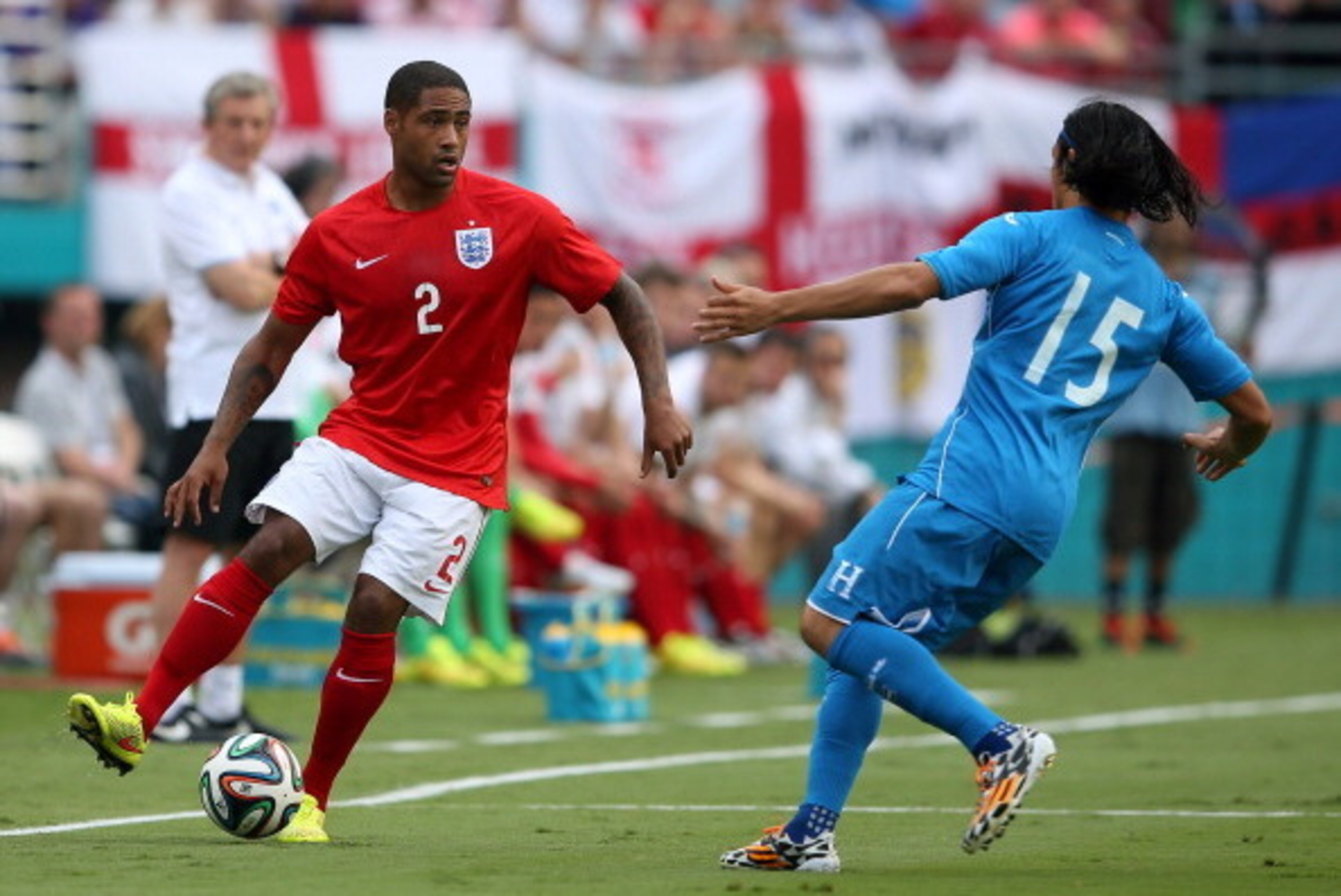MIAMI GARDENS, FL - JUNE 07: Glen Johnson of England dribbles against Roger Espinoza of Honduras in the first half during the International Friendly match between England and Honduras at Sun Life Stadium on June 7, 2014 in Miami Gardens, Florida.  (Photo 