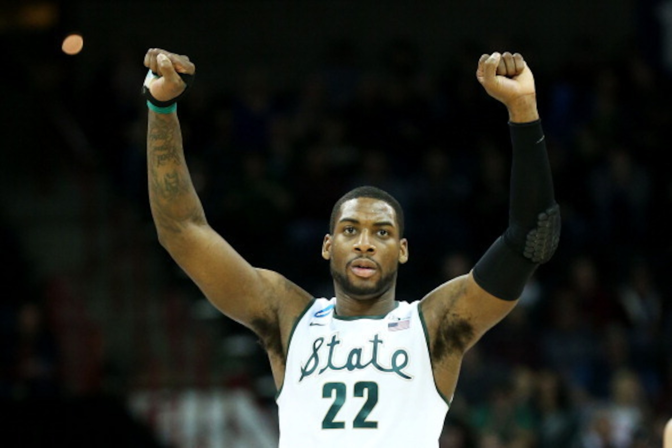 SPOKANE, WA - MARCH 22:  Branden Dawson #22 of the Michigan State Spartans celebrates in the second half against the Harvard Crimson during the Third Round of the 2014 NCAA Basketball Tournament at Spokane Veterans Memorial Arena on March 22, 2014 in Spok
