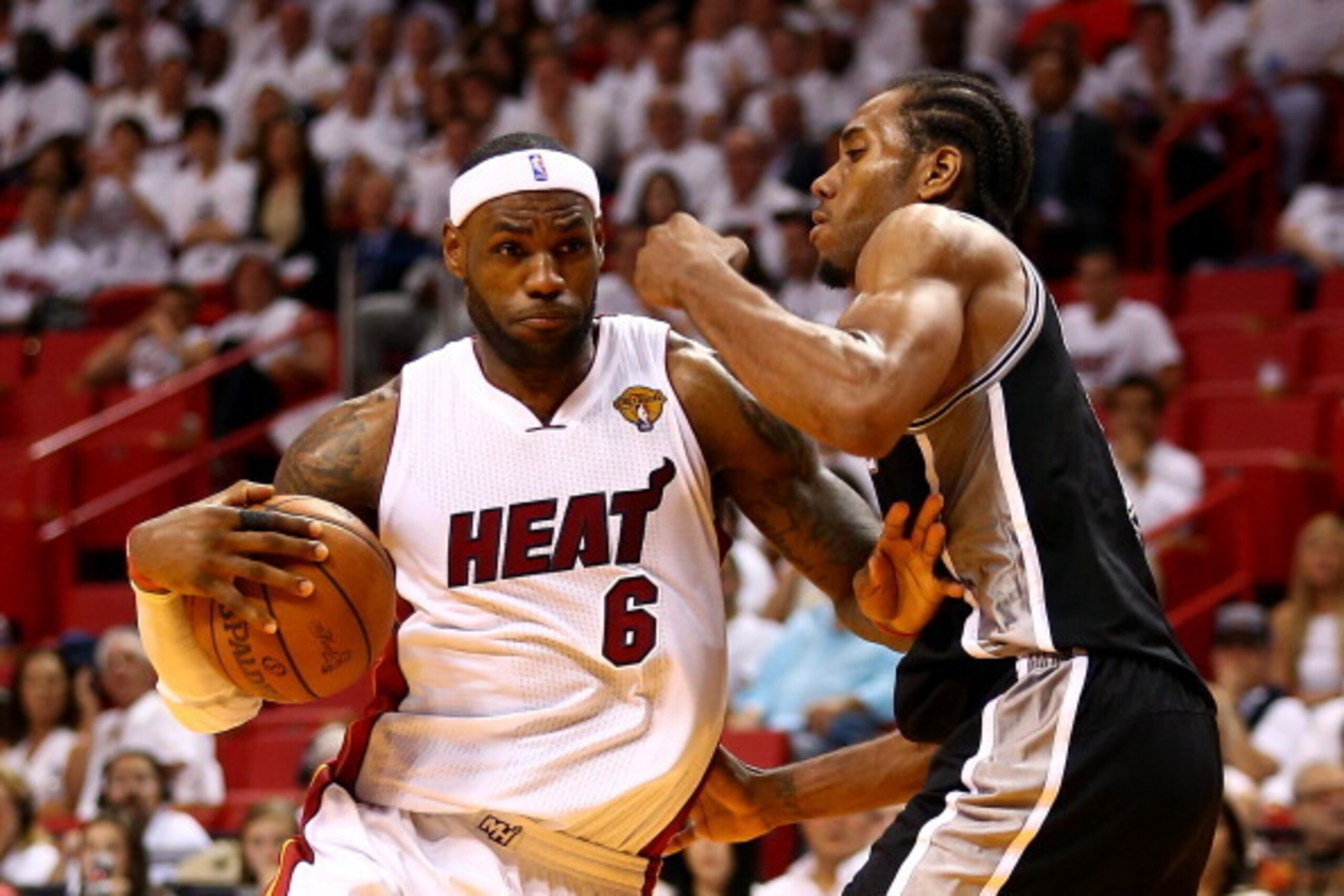 MIAMI, FL - JUNE 10: LeBron James #6 of the Miami Heat drives to the basket against Kawhi Leonard #2 of the San Antonio Spurs during Game Three of the 2014 NBA Finals at American Airlines Arena on June 10, 2014 in Miami, Florida. NOTE TO USER: User expres MIAMI, FL - JUNE 10: LeBron James #6 of the Miami Heat drives to the basket against Kawhi Leonard #2 of the San Antonio Spurs during Game Three of the 2014 NBA Finals at American Airlines Arena on June 10, 2014 in Miami, Florida. NOTE TO USER: User expres