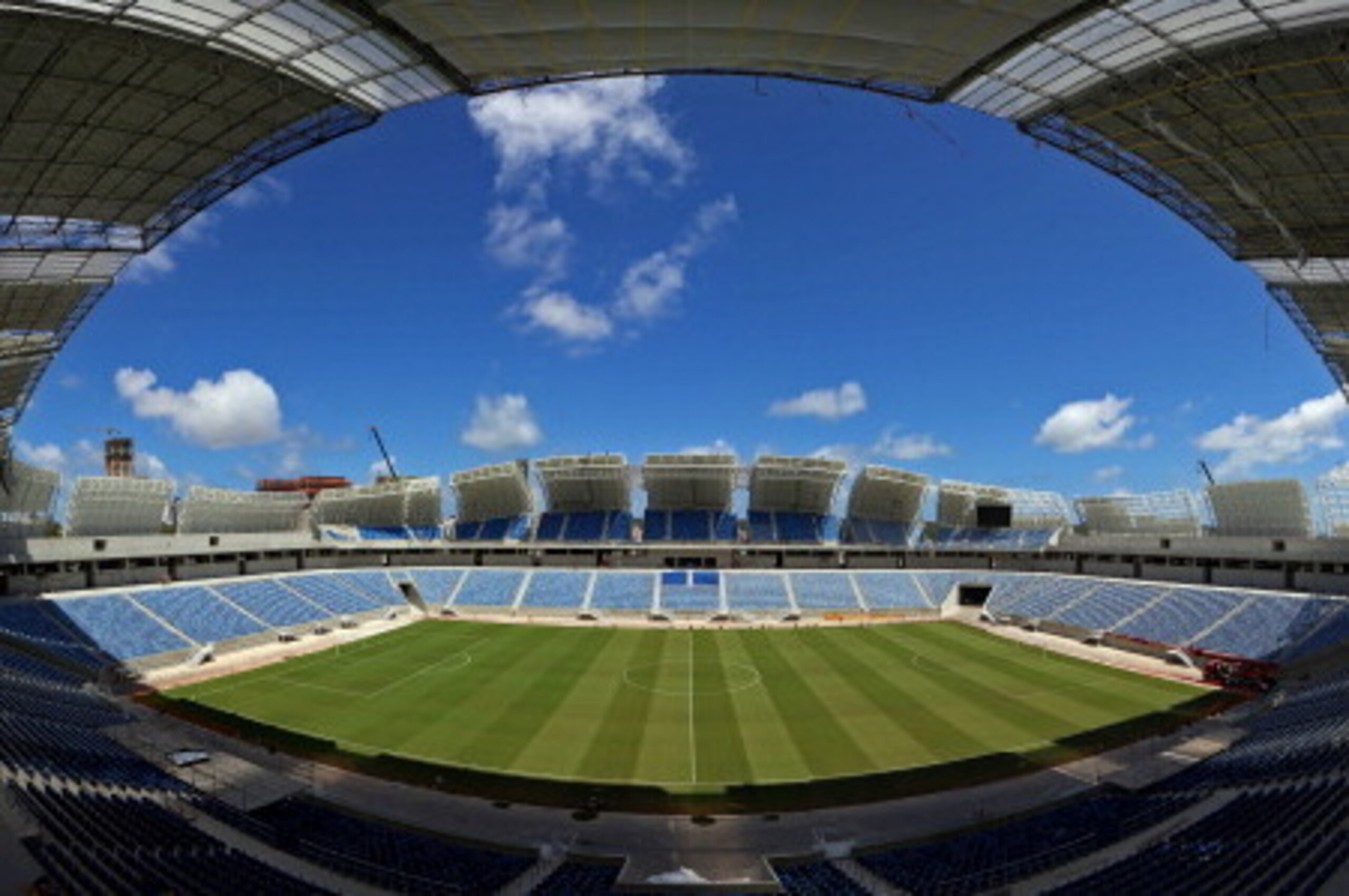 NATAL, BRAZIL - DECEMBER 13:  (***EDITORS NOTE*** THIS PANORAMIC COMPOSITE IMAGE WAS CREATED USING PHOTO STITCHING SOFTWARE)  The pitch is seen as construction continues at the at Estadio das Dunas on December 13, 2013 in Natal, Brazil.  The stadium will 